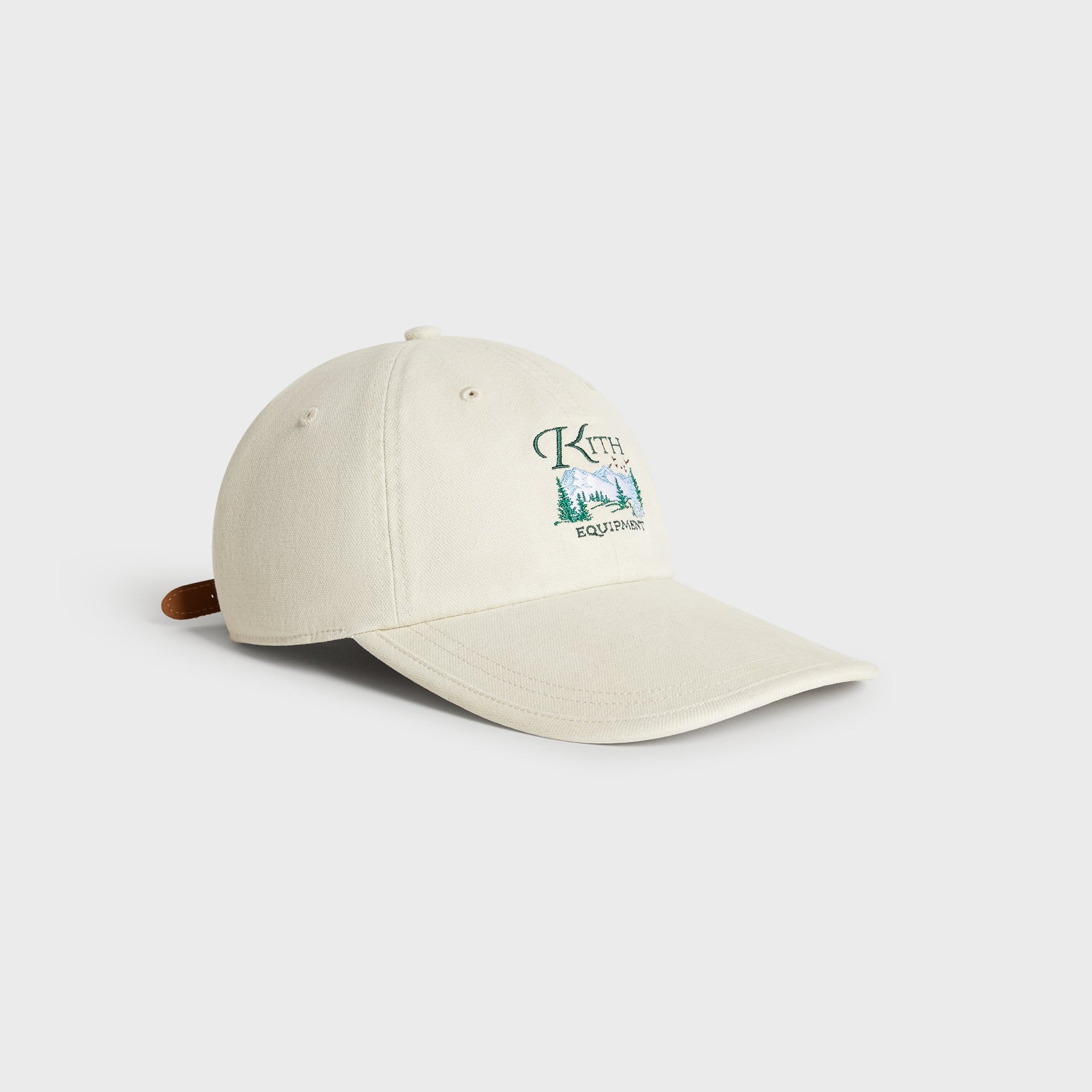 Kith & '47 Canvas Long Visor Clean Up Cap in Sandrift, angled 3/4 view showing long visor and leather strap