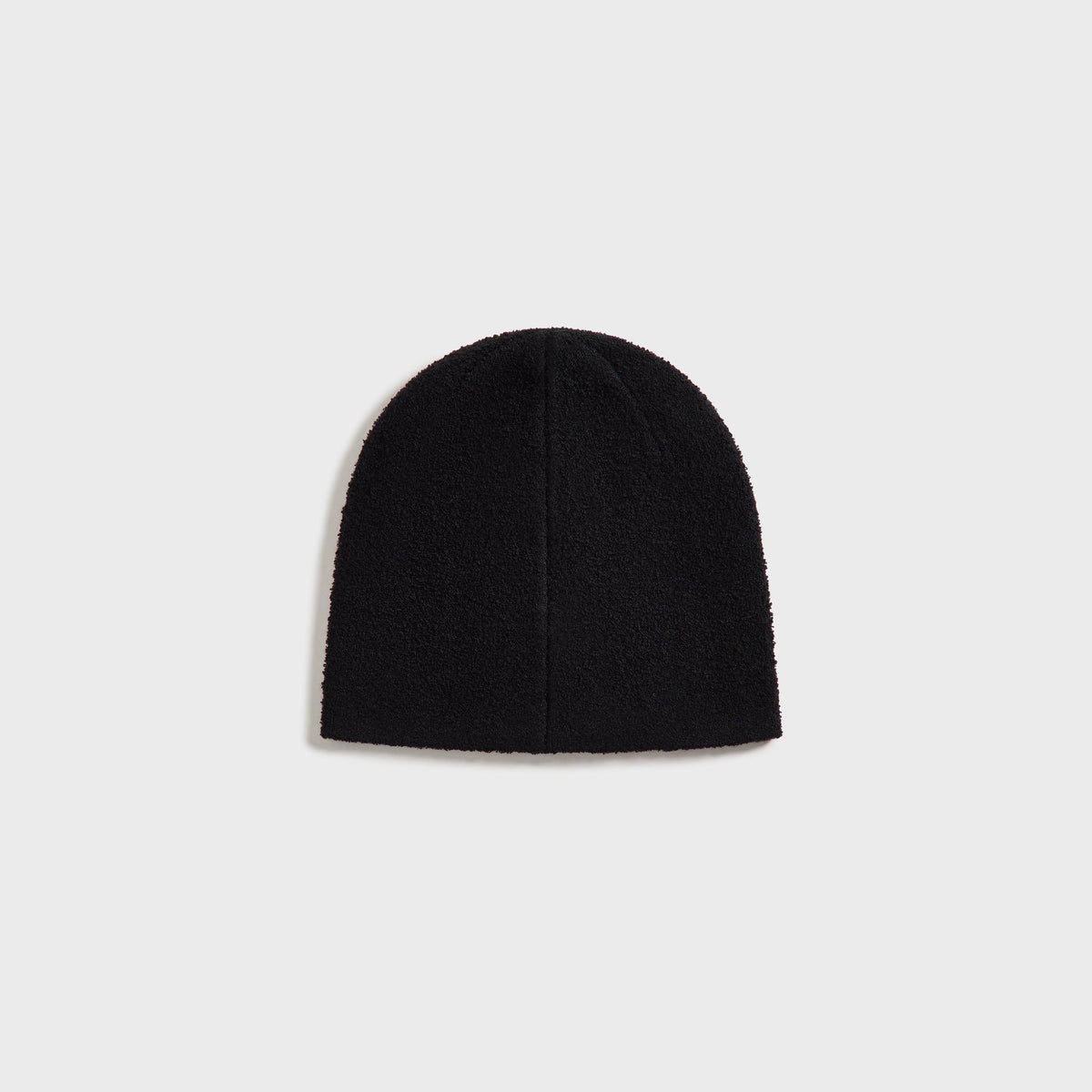 Kith Boucle Cuffless Beanie in black, back view showing the ribbed bouclé knit texture