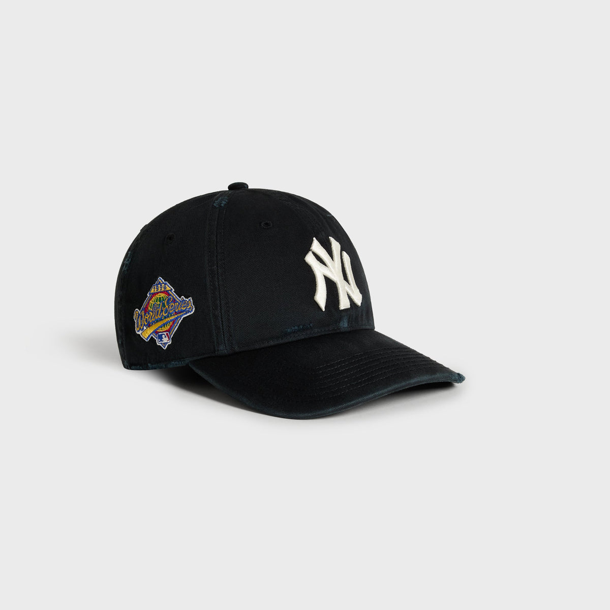 Kith & '47 Yankees cap in black, front three-quarter angle showing NY logo and 1999 World Series patch