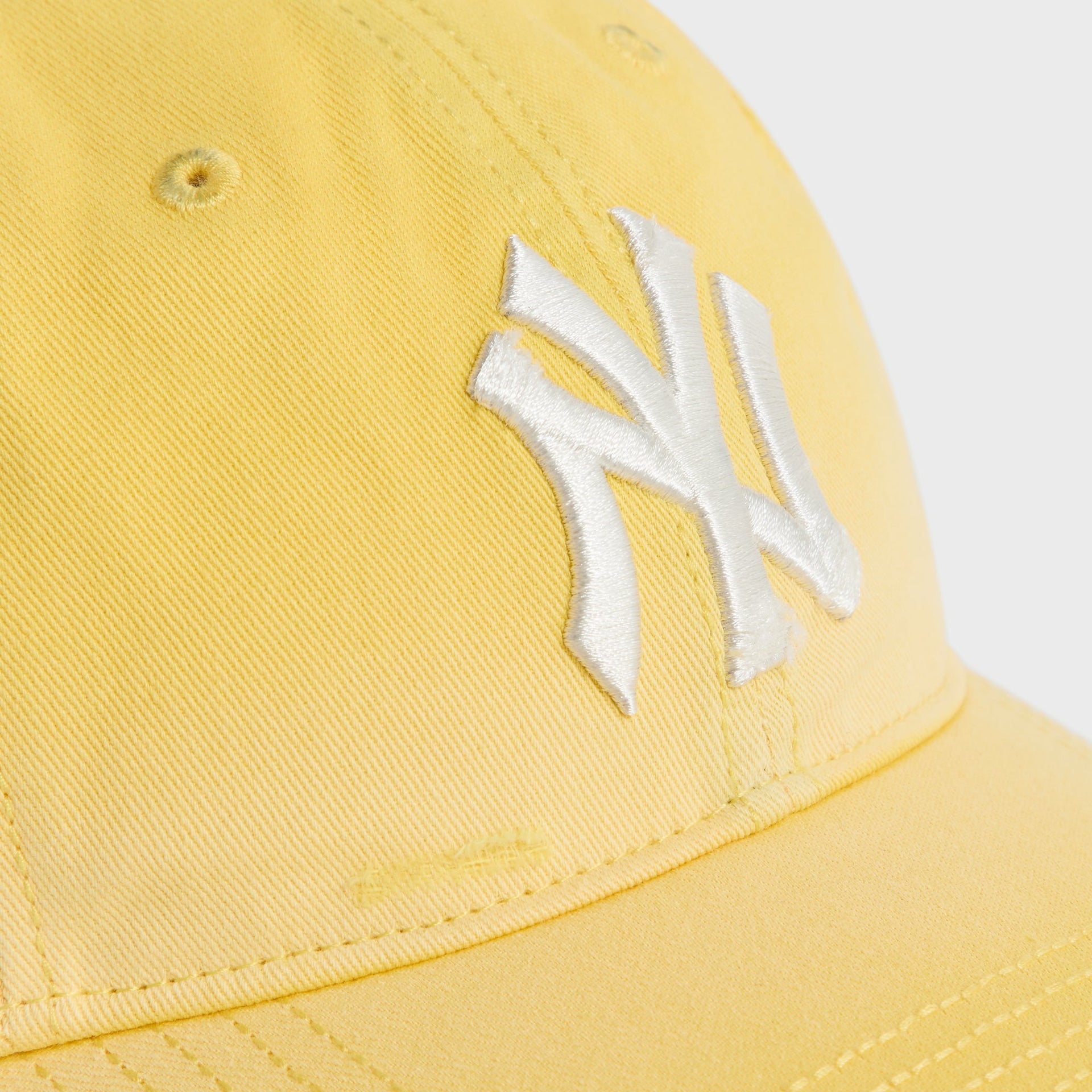 Close-up of white NY logo embroidery on Buzz Sun Faded Franchise LS Cap