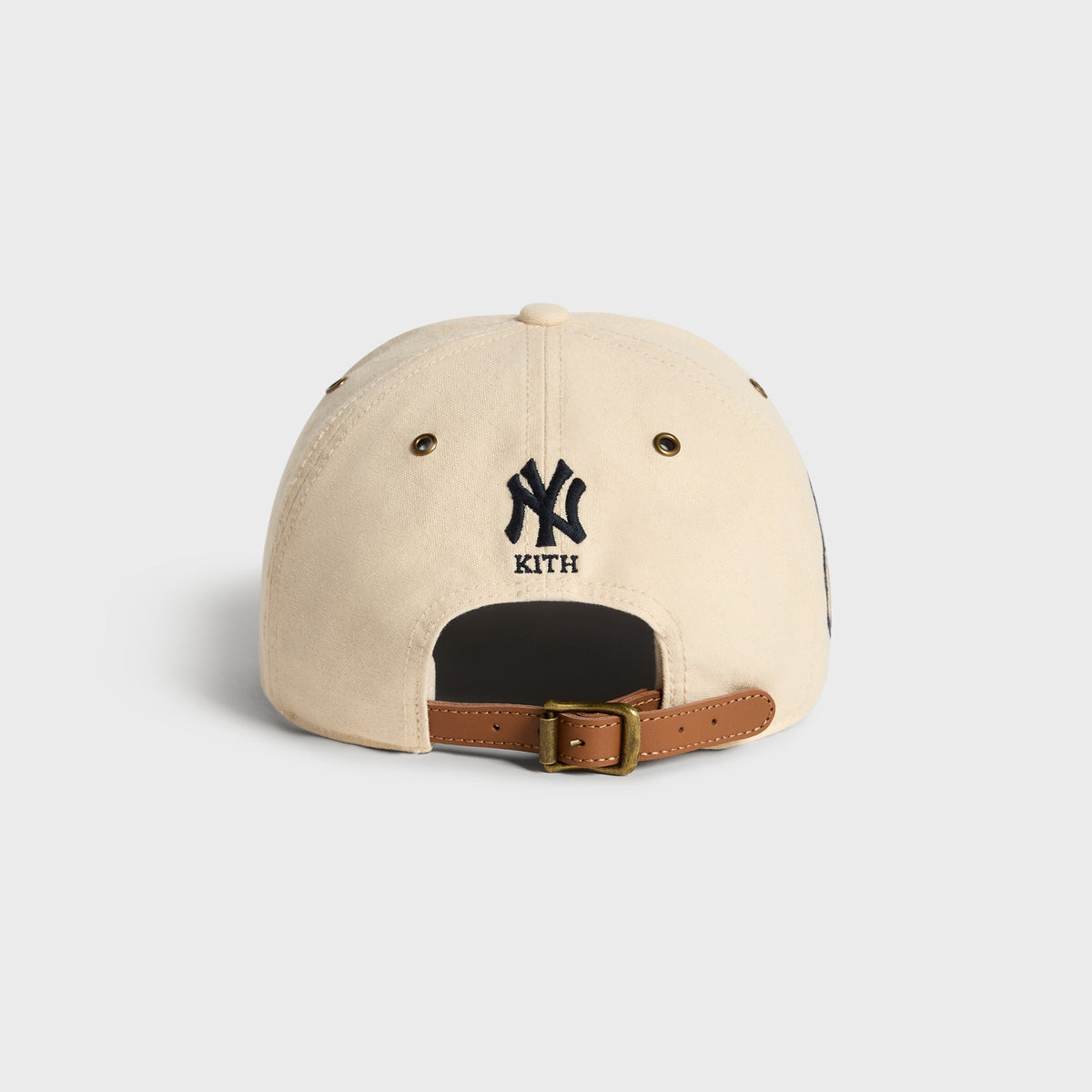 Kith & '47 Clean Up Duck Canvas Long Visor Cap in Sandrift, back view with NY Kith logo above leather strap buckle