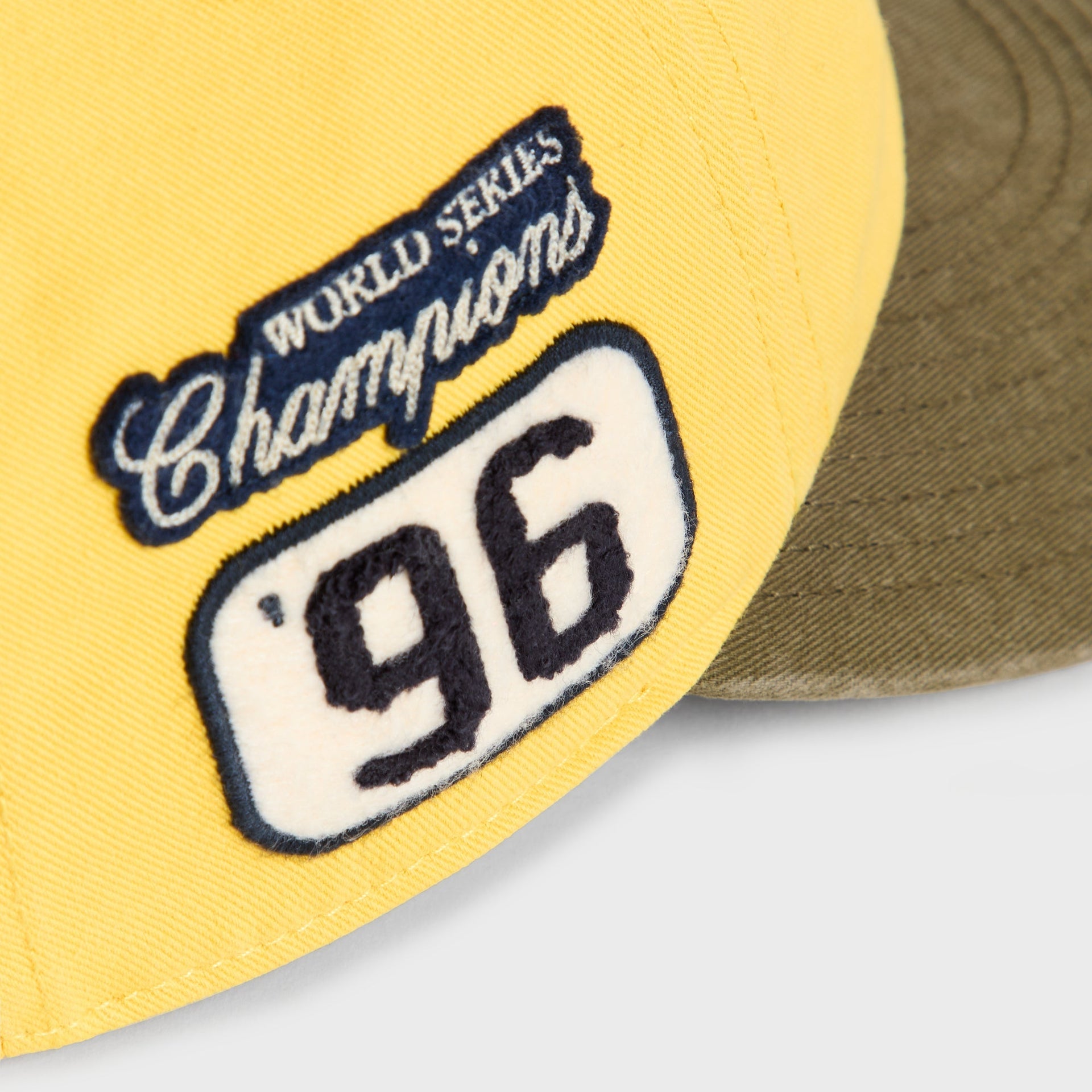Close-up of World Series Champions '96 patch on Buzz Clean Up Round Visor Cap