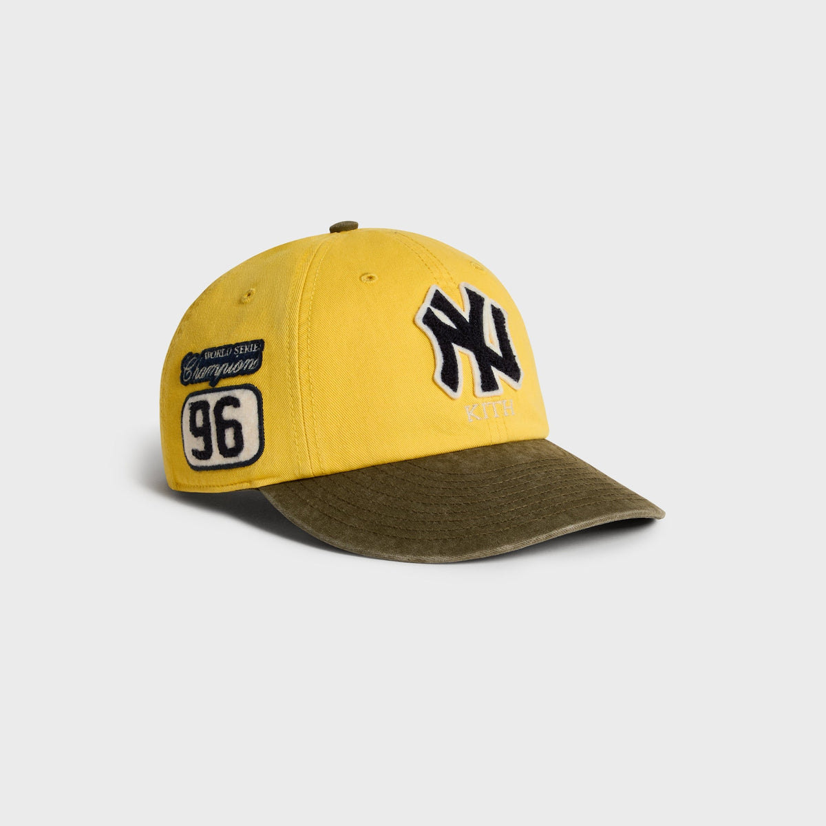 Kith & '47 Clean Up Round Visor Cap in Buzz, angled view showing NY patch and World Series Champions patch