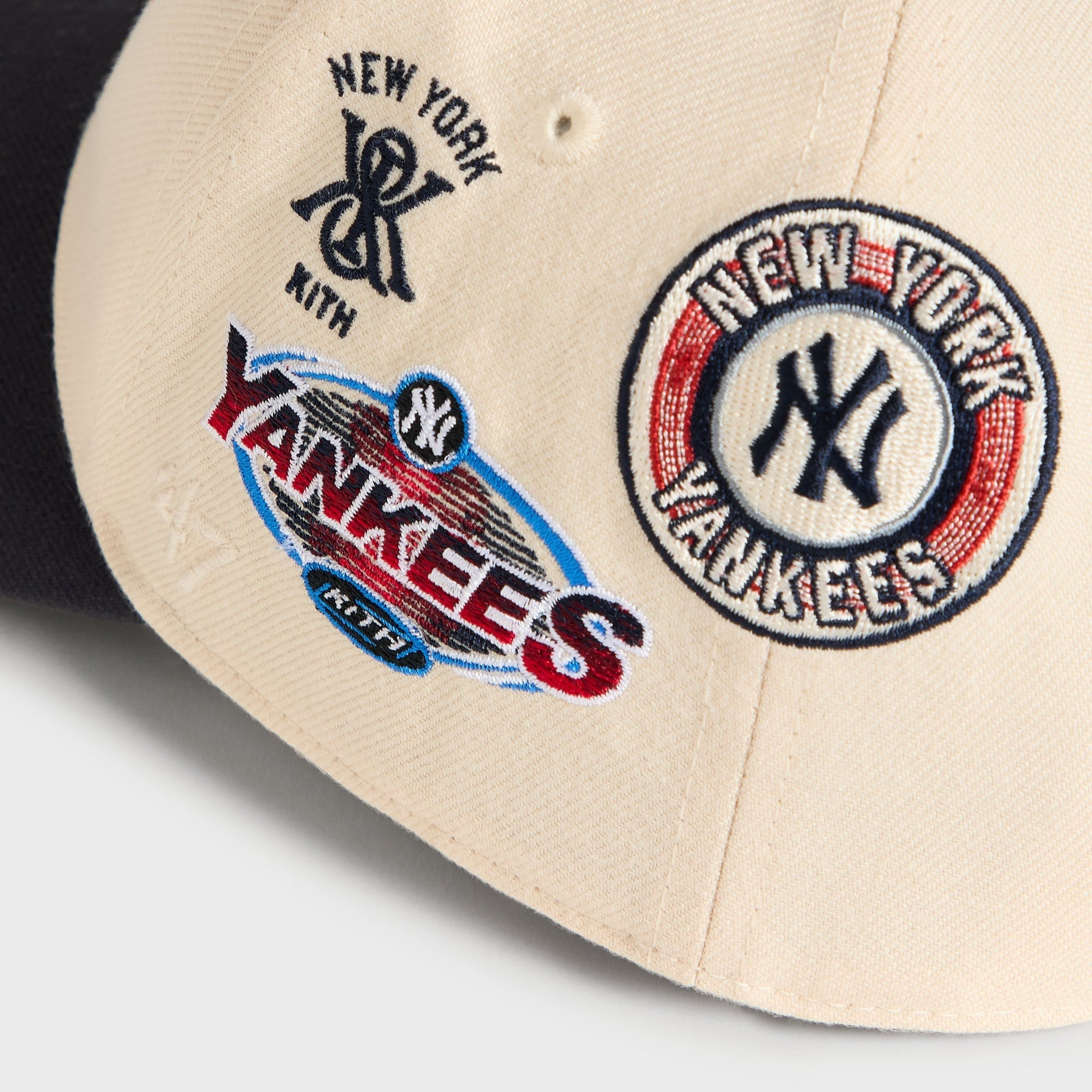 Detail of right-side patches: New York Kith monogram and Yankees circular logo on Sandrift cap