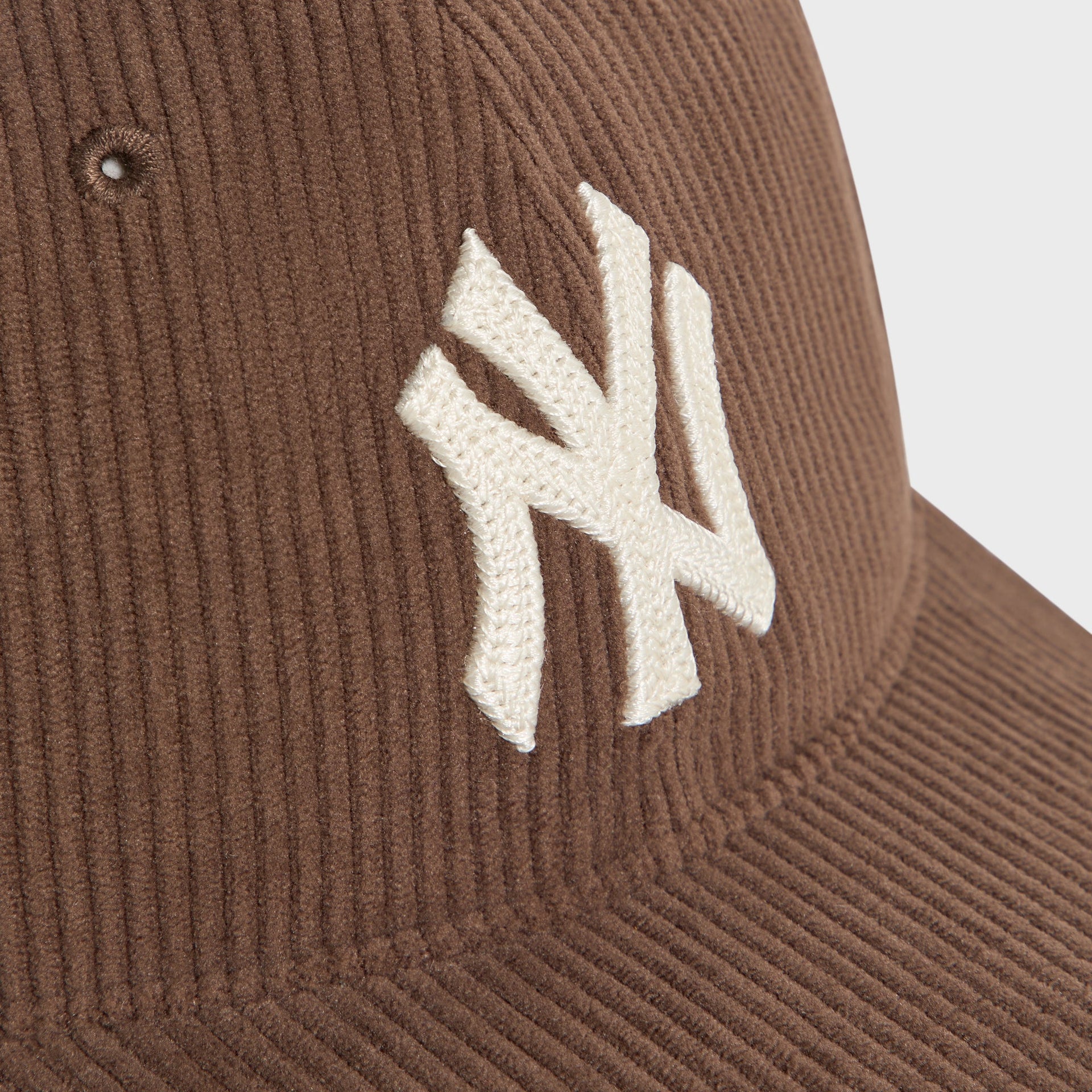 Close-up of the NY Yankees logo embroidery and ribbed corduroy texture on the Kith & '47 Franchise LS Cap in Kindling brown.