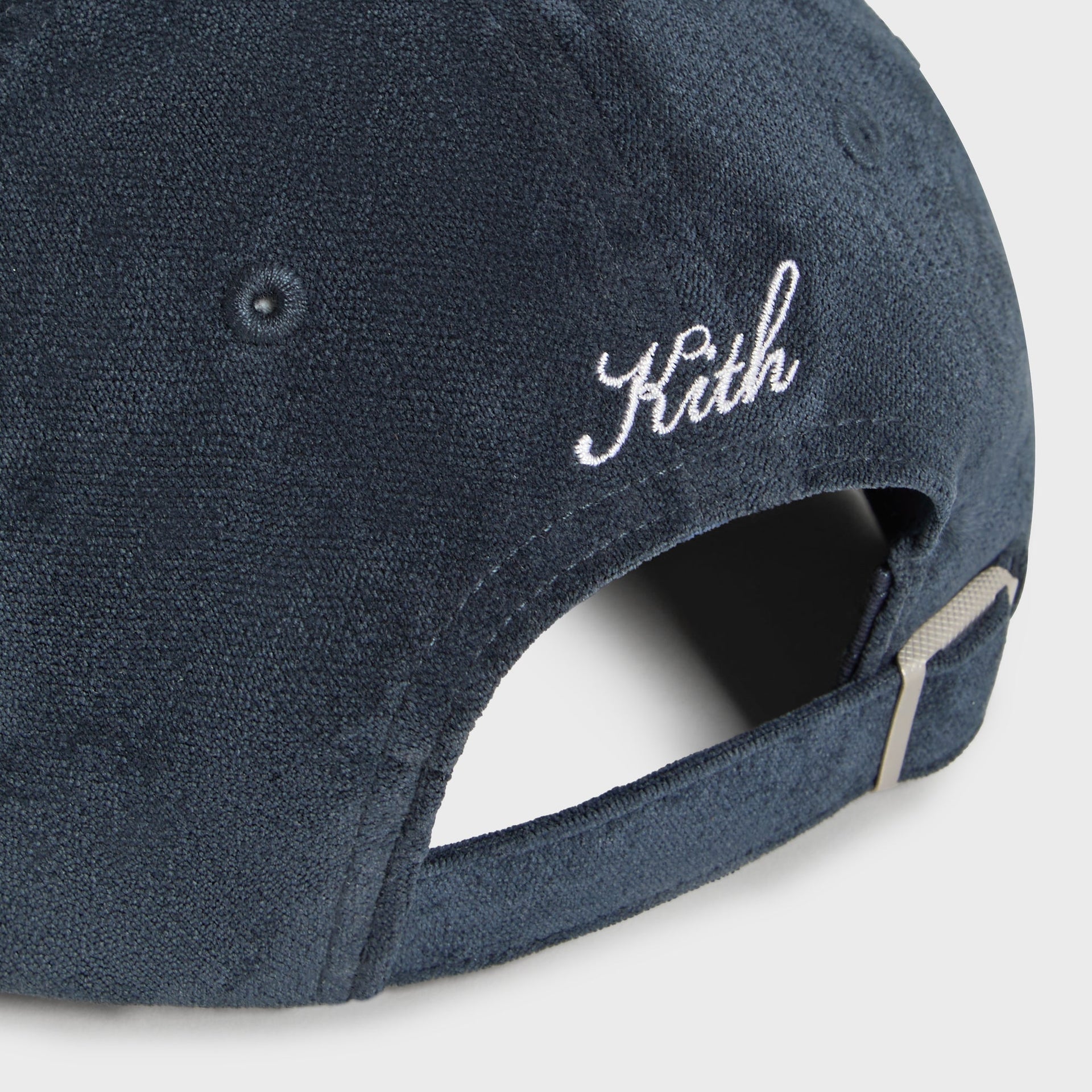 Close-up detail of adjustable back strap and cream Kith script embroidery, Dodgers Long Bill cap