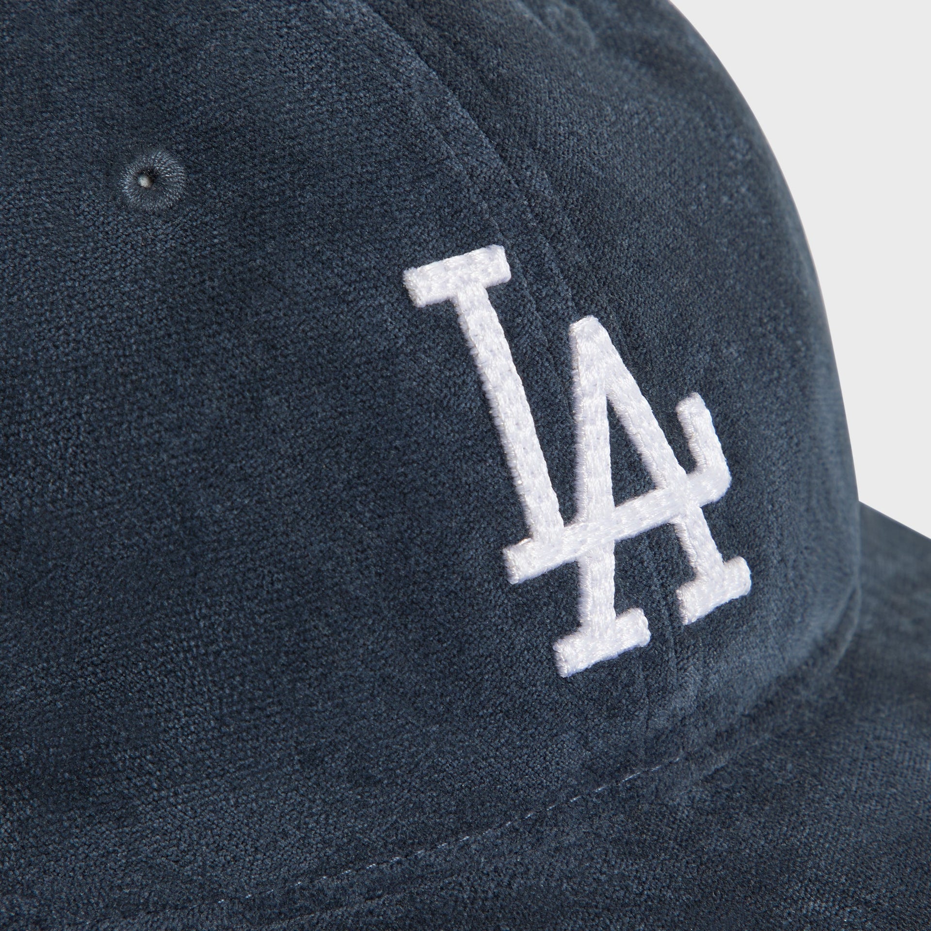 Close-up detail of white LA logo embroidery on the Nocturnal navy velour Dodgers Long Bill cap