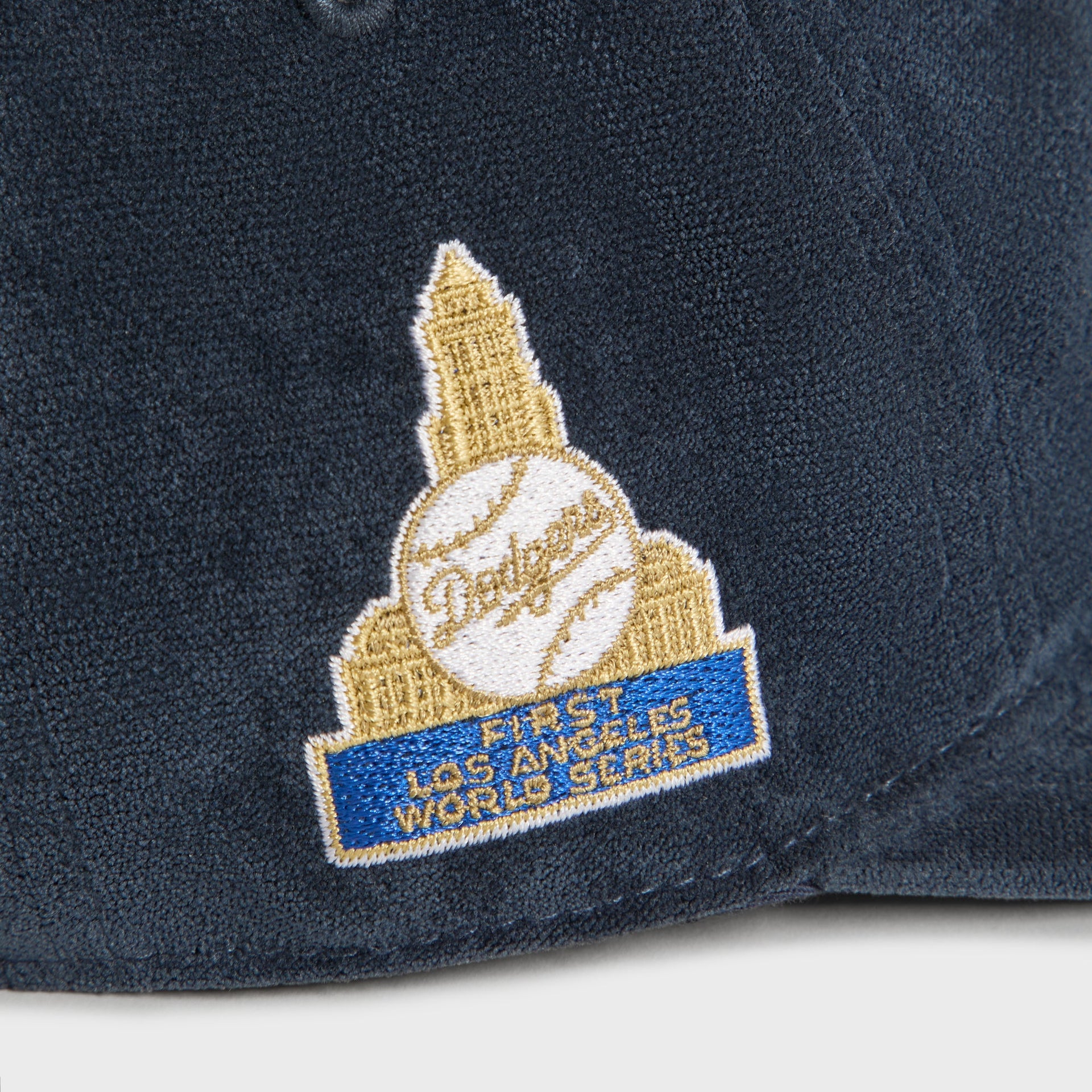 Close-up detail of gold and blue First Los Angeles World Series patch on the Dodgers Long Bill cap