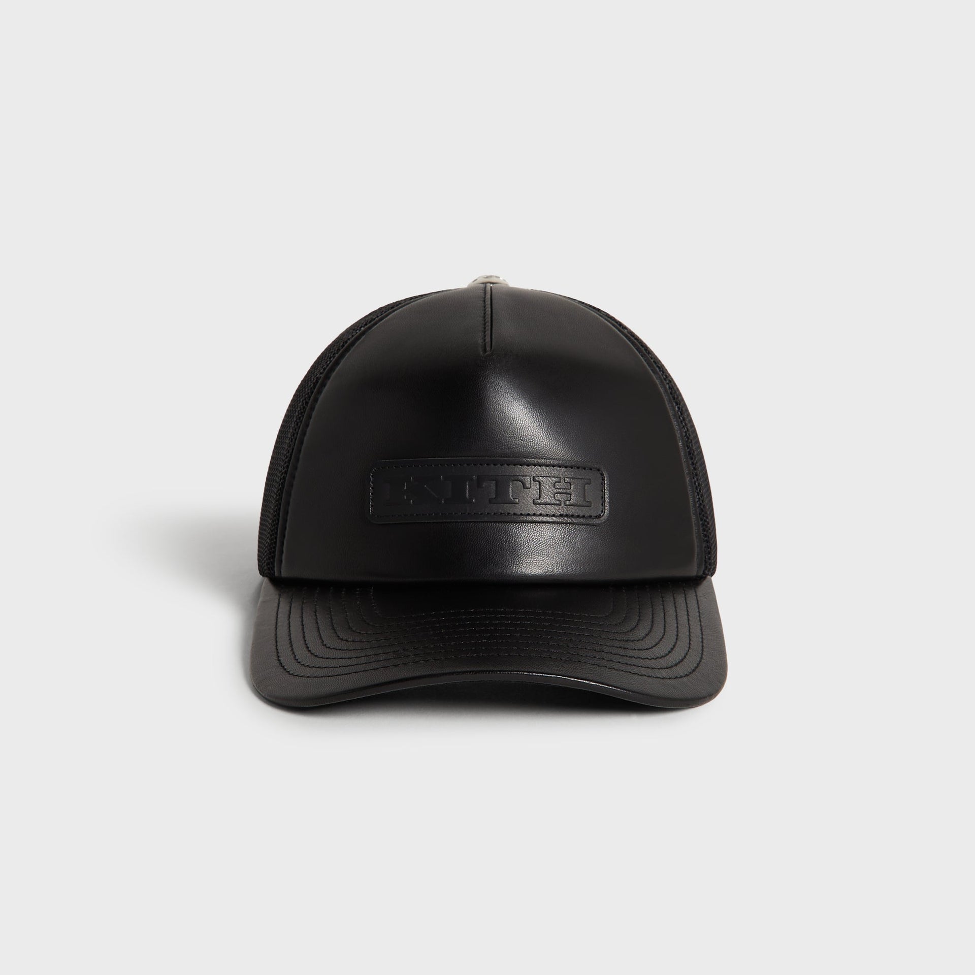 Kith Smooth Leather Nolan Trucker Hat in Black, front view with leather crown and embossed KITH patch