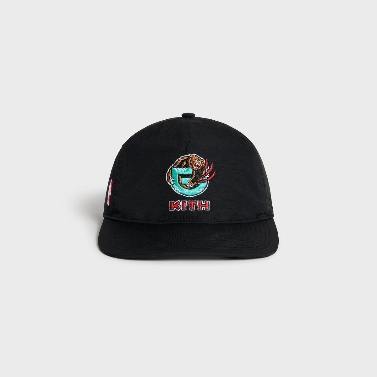 Kith & '47 Vancouver Grizzlies snapback cap in black, front three-quarter view with embroidered teal bear logo and red Kith wordmark