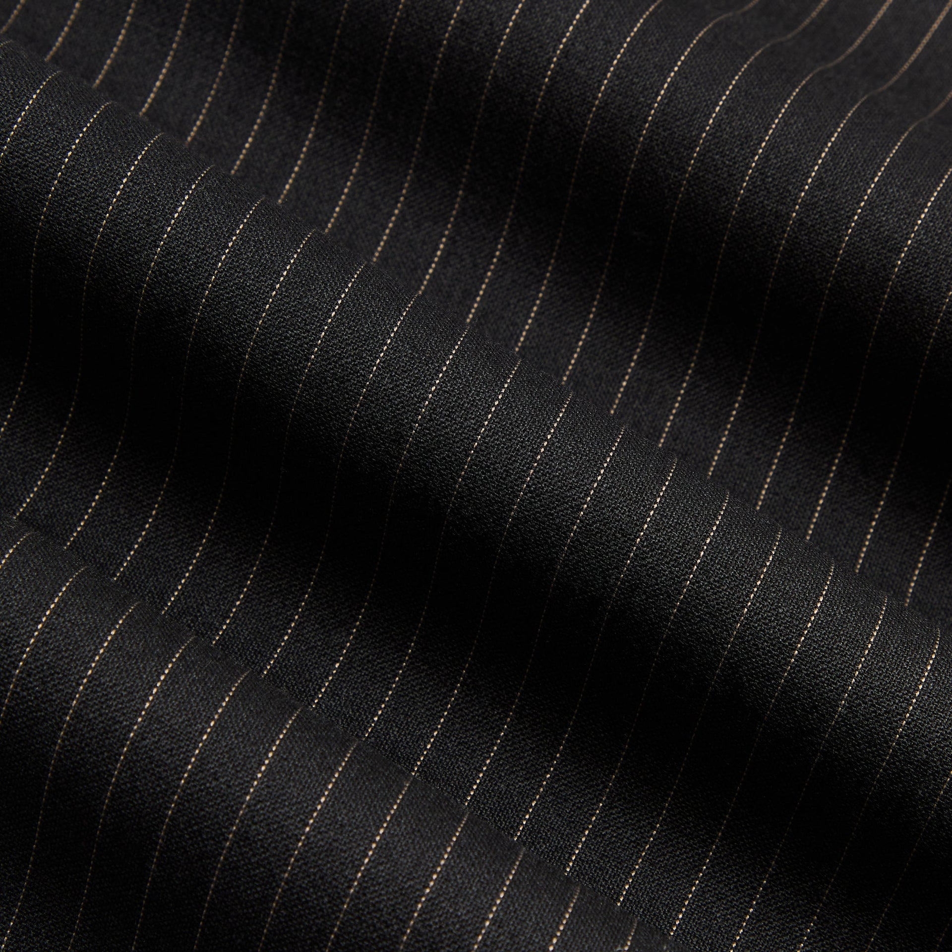 Close-up of the black and tan pinstripe weave on the Kith Pinstripe Idris pant