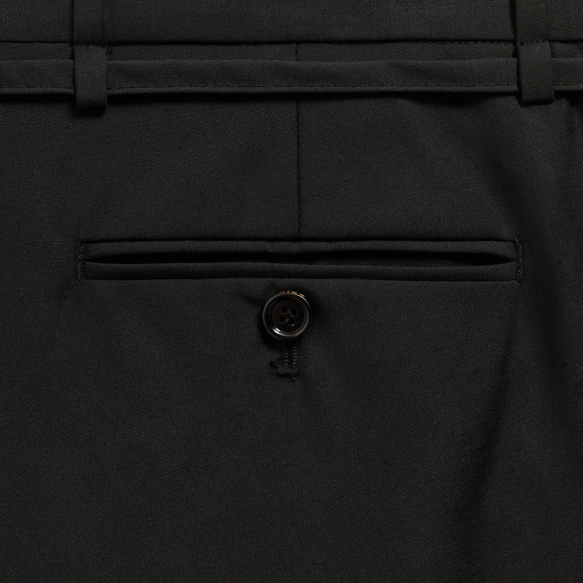 &Kin Eli Pleated Trouser detail of the button-through welt back pocket and belt loops