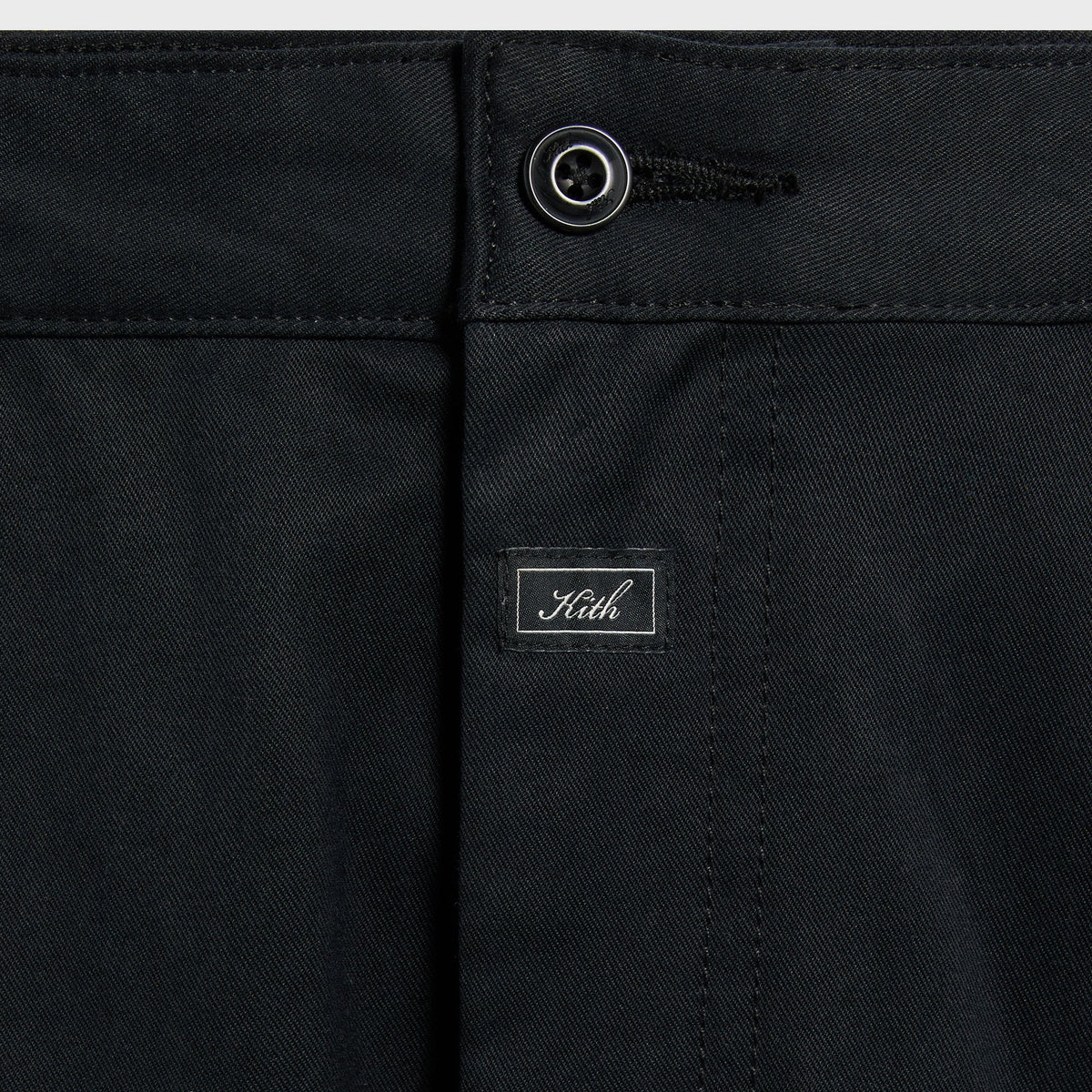 Close-up of the waistband and Kith label on the black Gus cargo pant