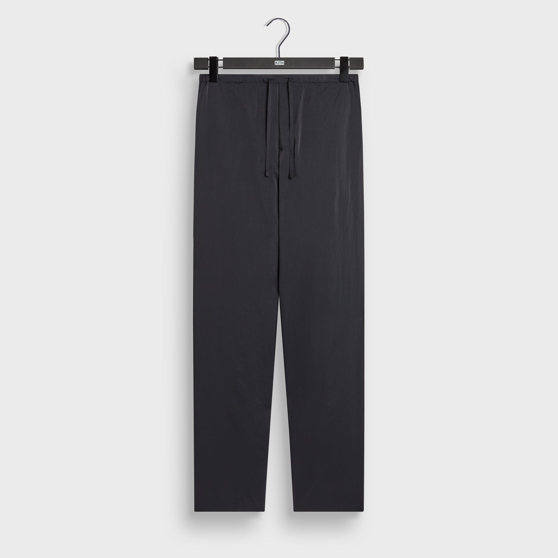 Kith Nylon Maverick pant in black with drawstring waist, front flat lay