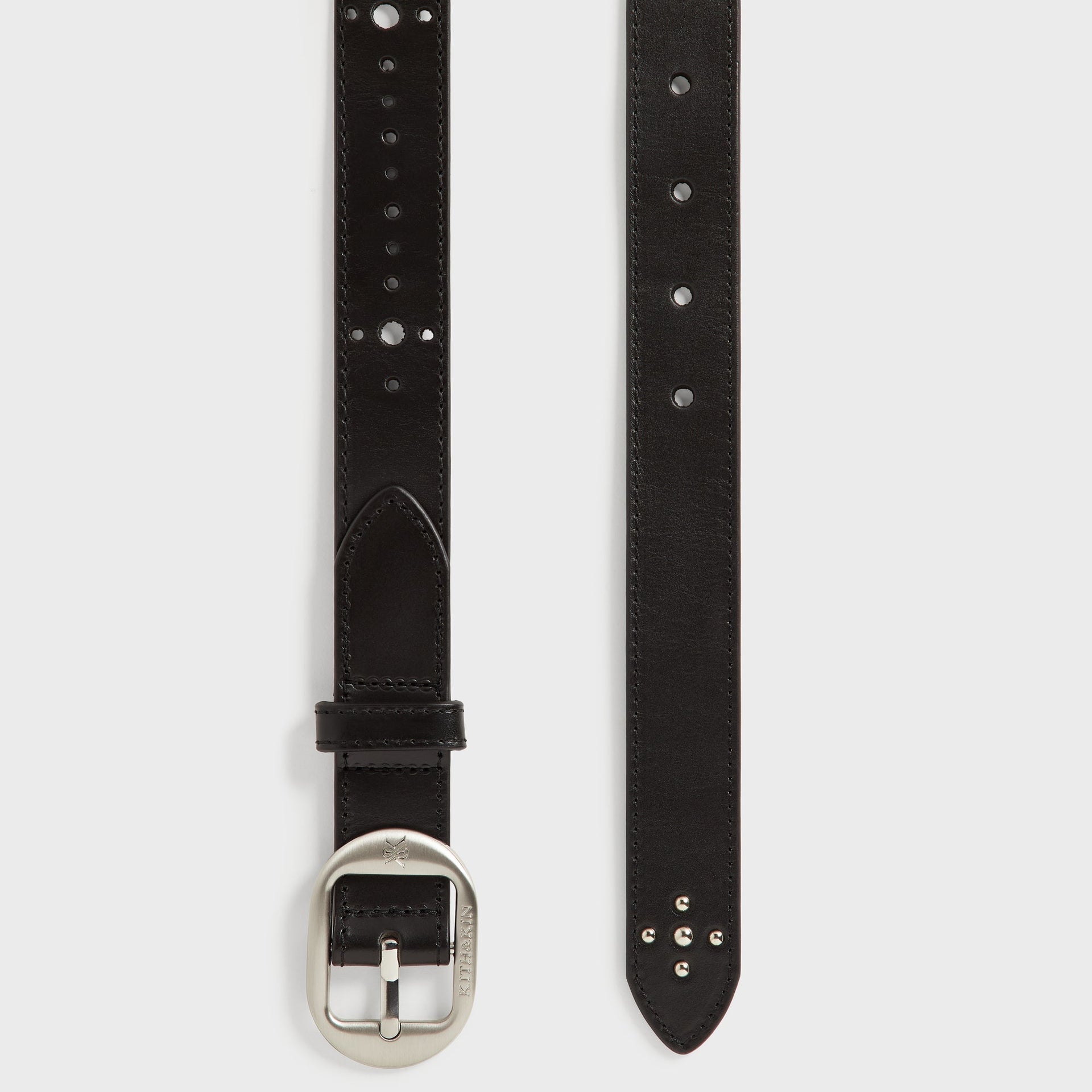 Kith Studded Leather Belt in Black, detail of the pointed tip end with adjustment holes and keeper loop