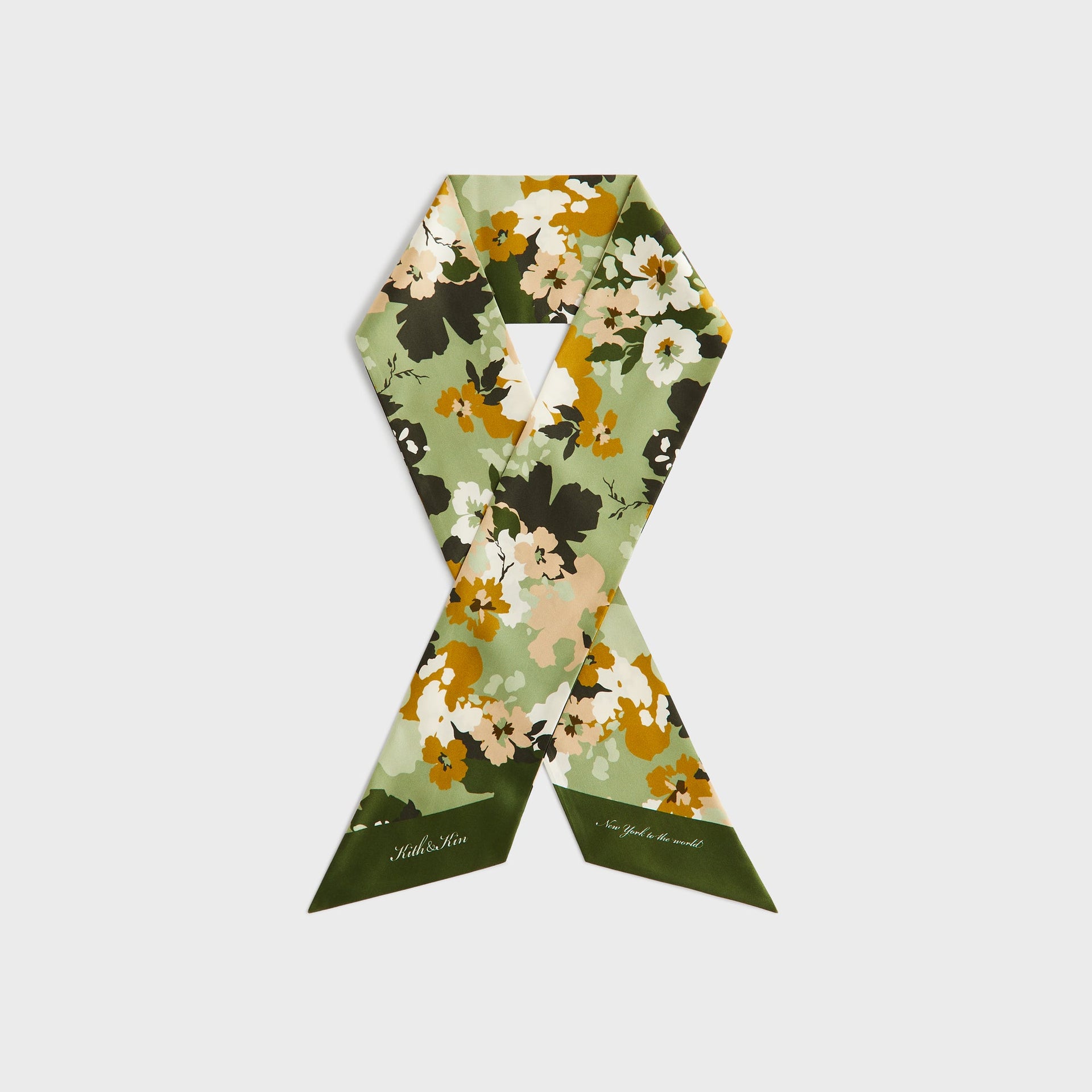 Kith Printed Silk Neck Tie in Sage floral print, styled crossed showing Kith & Kin and New York to the World text ends