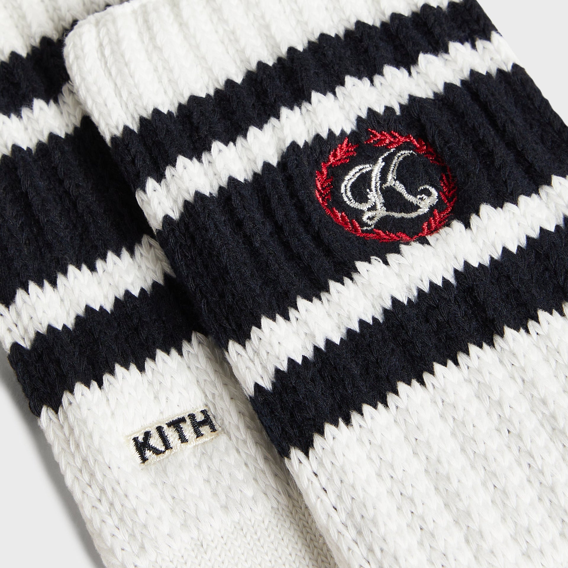 Kith Script K Laurel Stripe Cotton Chunky Crew Socks in White, close-up of embroidered laurel wreath K logo