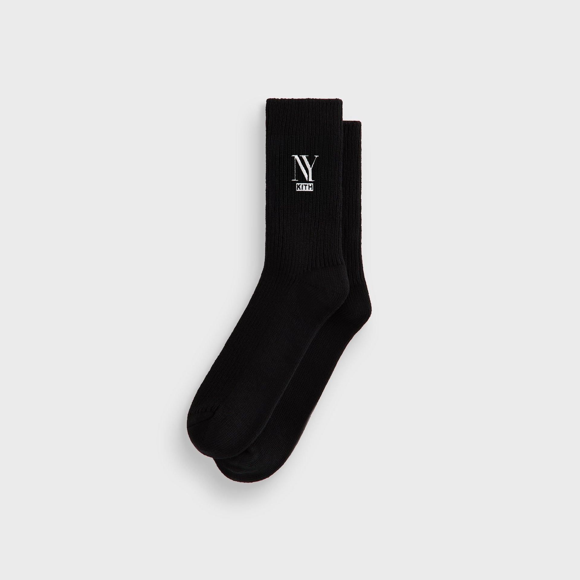 Kith NY Cotton Slouchy Crew Socks in Black, folded flat showing the embroidered NY Kith logo