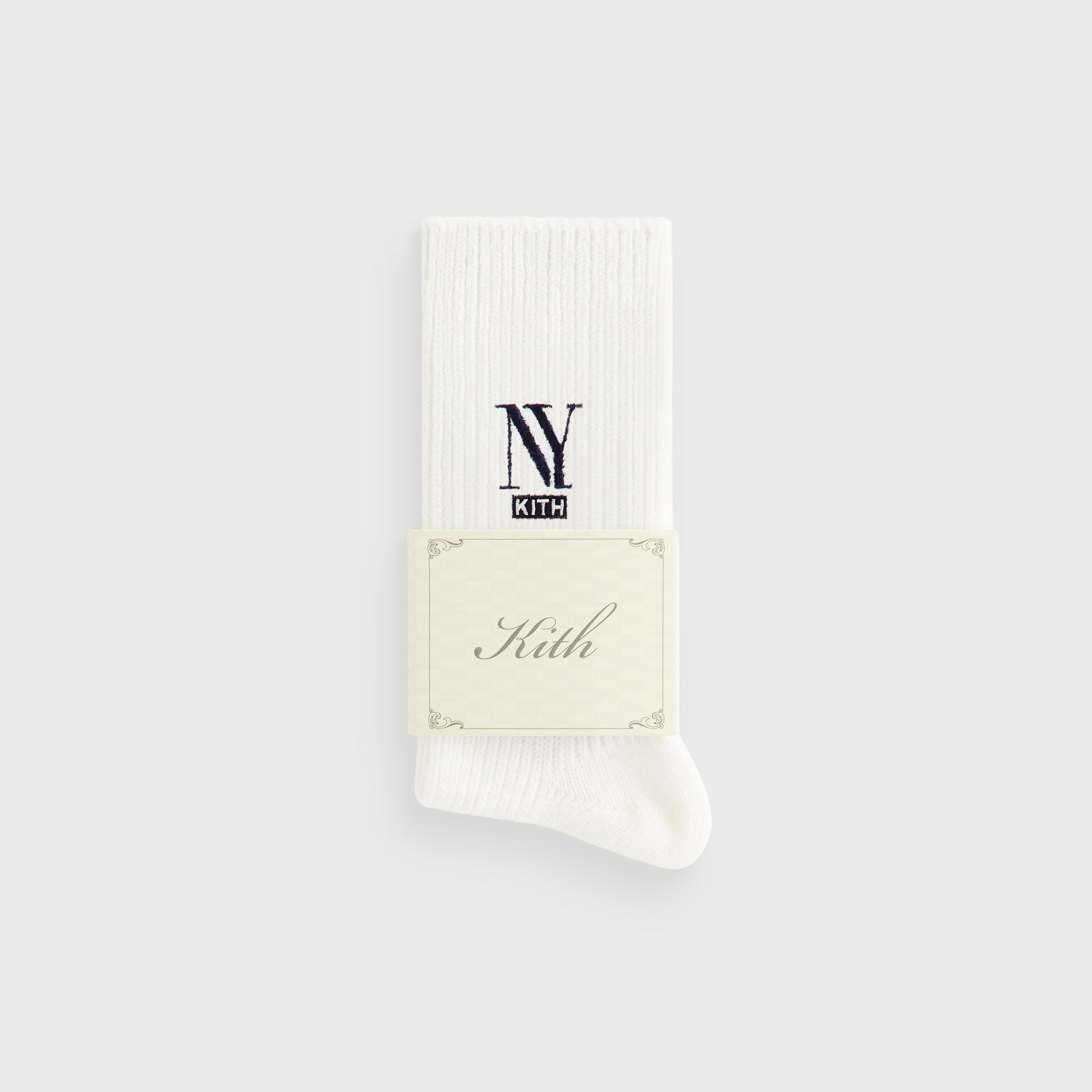 Kith NY Cotton Slouchy Crew Socks in Silk with folded Kith branded paper wrap around the cuff, toe seam visible