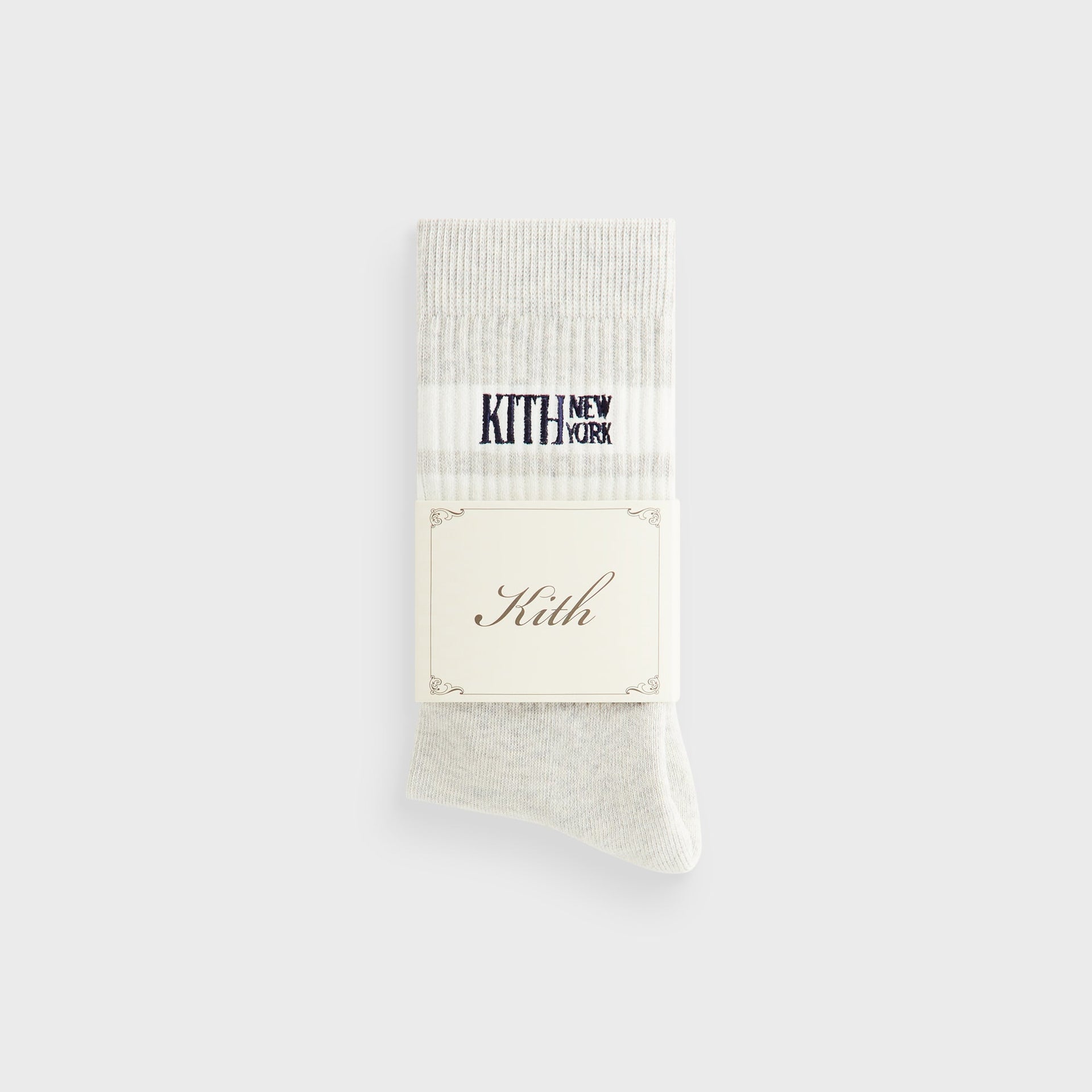 Kith Calf Stripe Socks in Heather Grey, folded pair shown with the Kith branded paper packaging band.