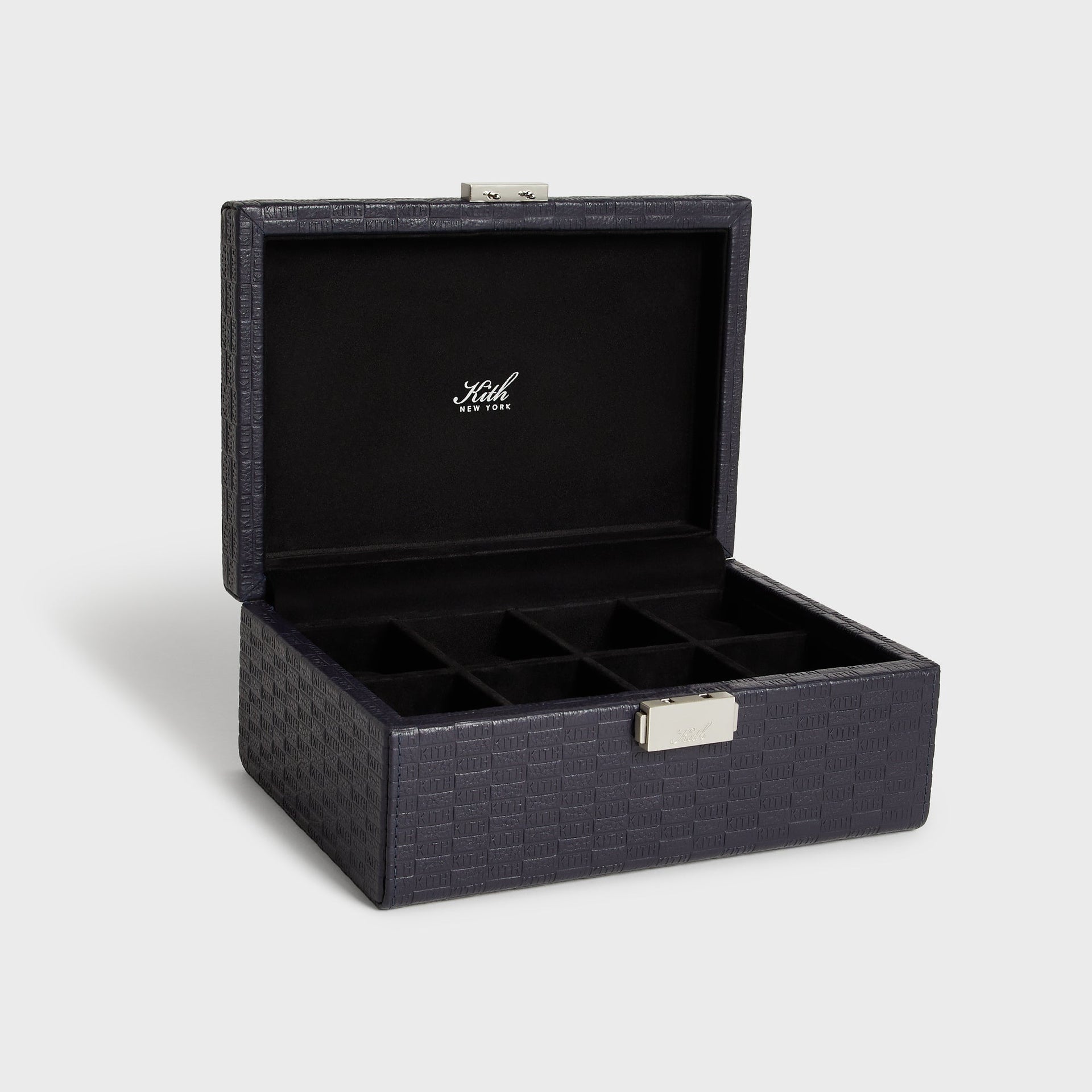 Kith Monogram Tumbled Saffiano Leather Watch Box in Ink navy, open at angle showing ten-slot compartment interior
