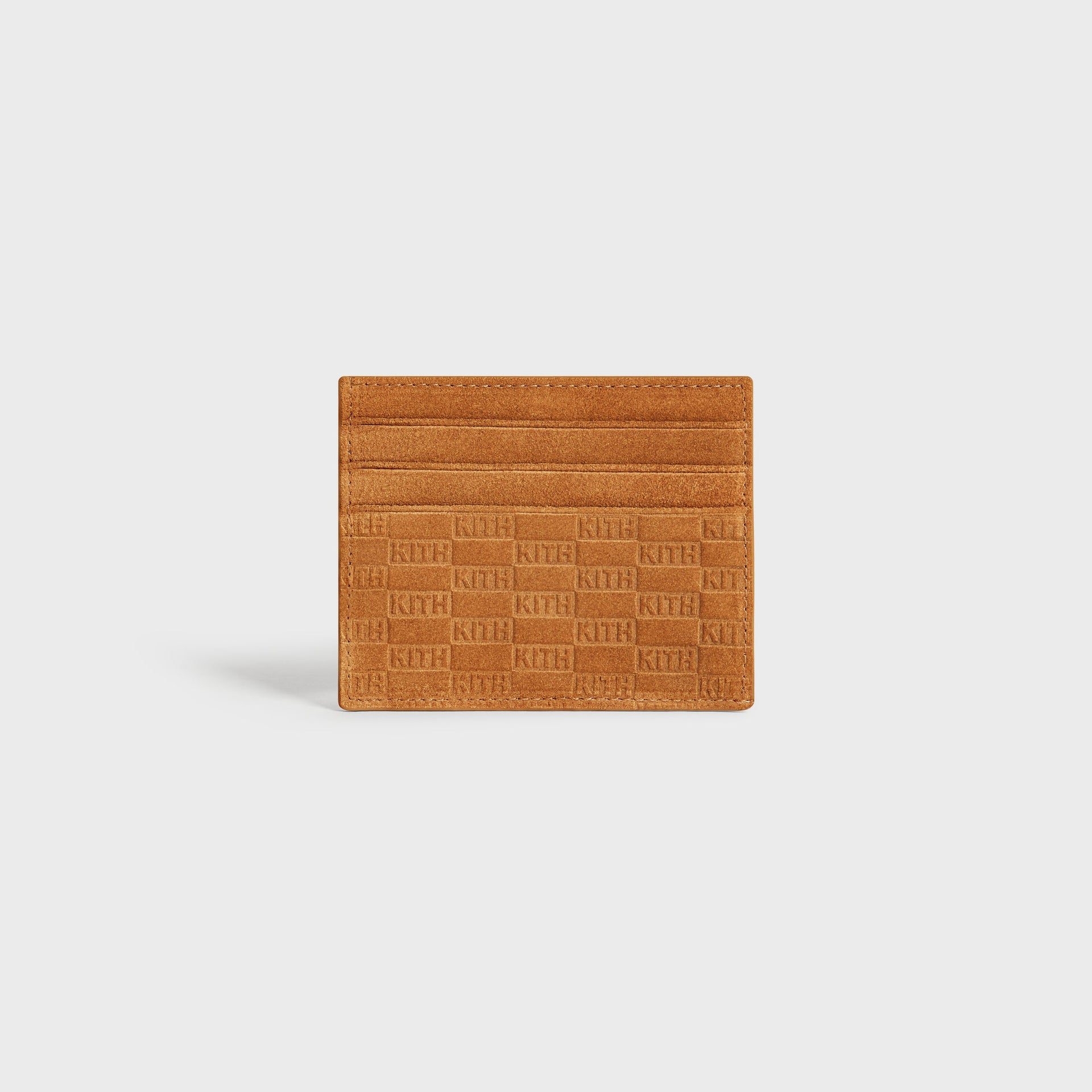 Kith Monogram Suede Cardholder in Argil tan, front view showing card slots and embossed KITH pattern