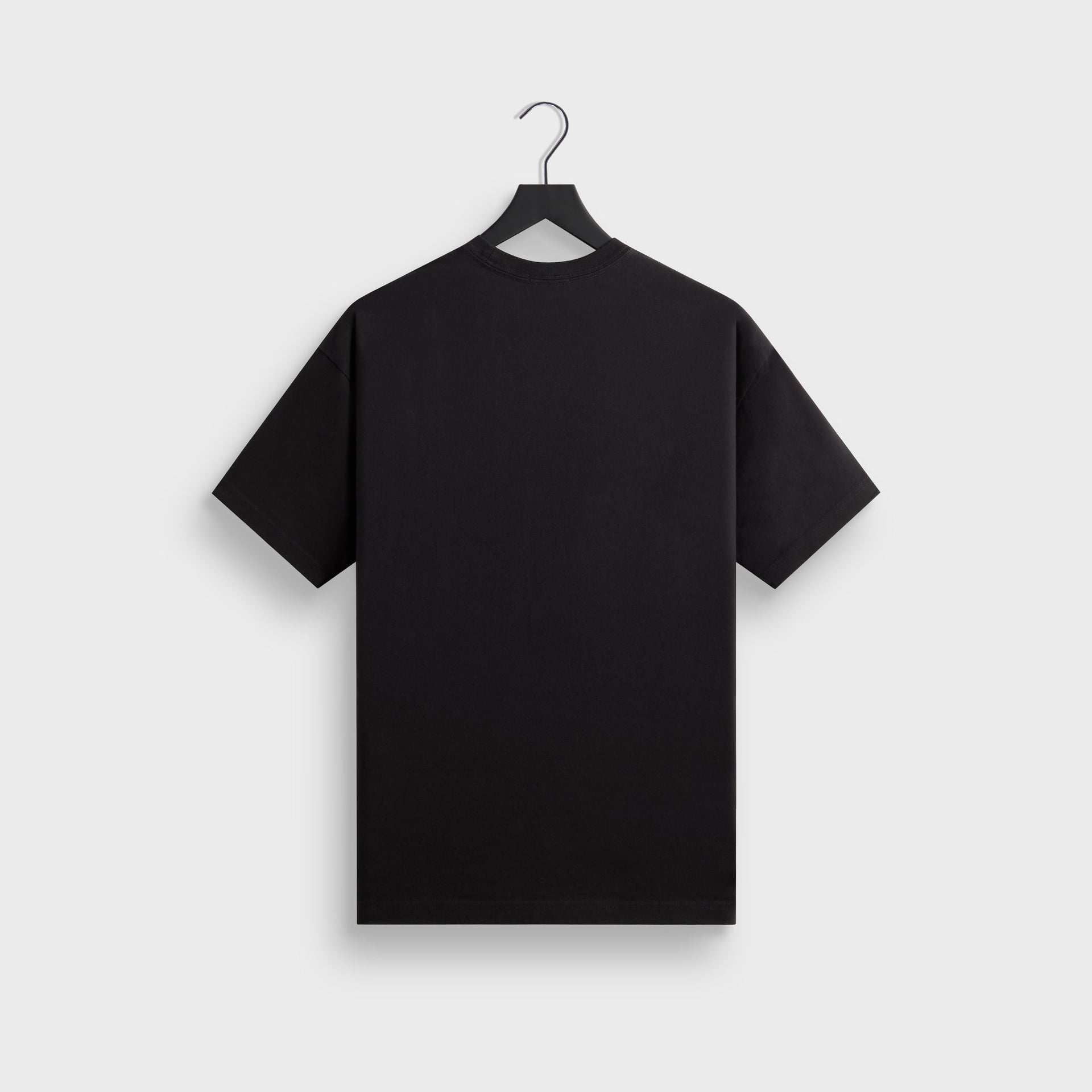 Kith for Cinelli Upside Down Tee in black, plain back view on hanger showing the ribbed crewneck and short sleeves.