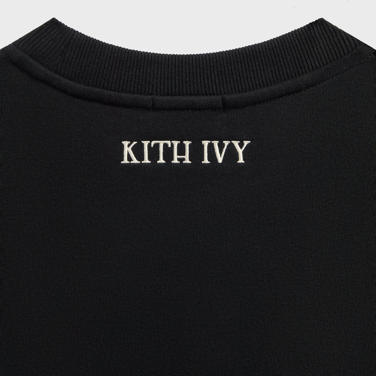 Close-up of black Kith Ivy Emblem Crewneck back neck with cream KITH IVY embroidery and ribbed collar