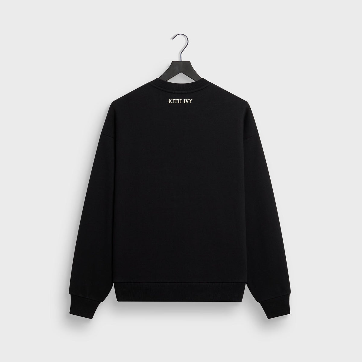 Kith Ivy Emblem Vintage Crewneck in black, back flat lay on hanger with small KITH IVY text at neck