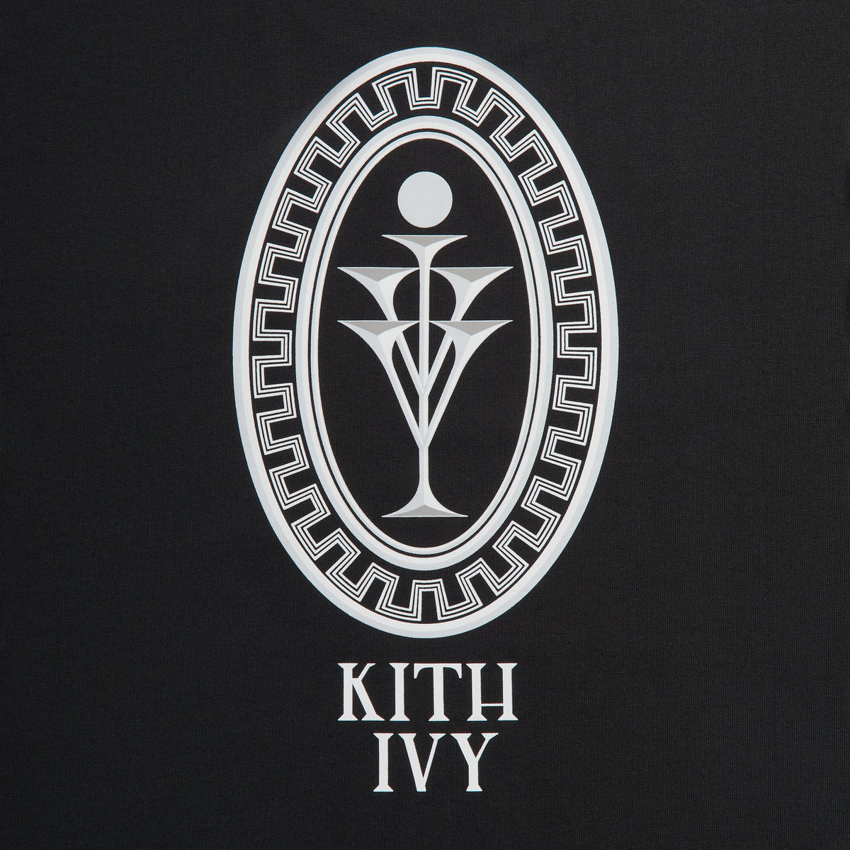Close-up of large white Greek key oval goblet emblem and KITH IVY text on back of Cafe Mogador Pocket Tee