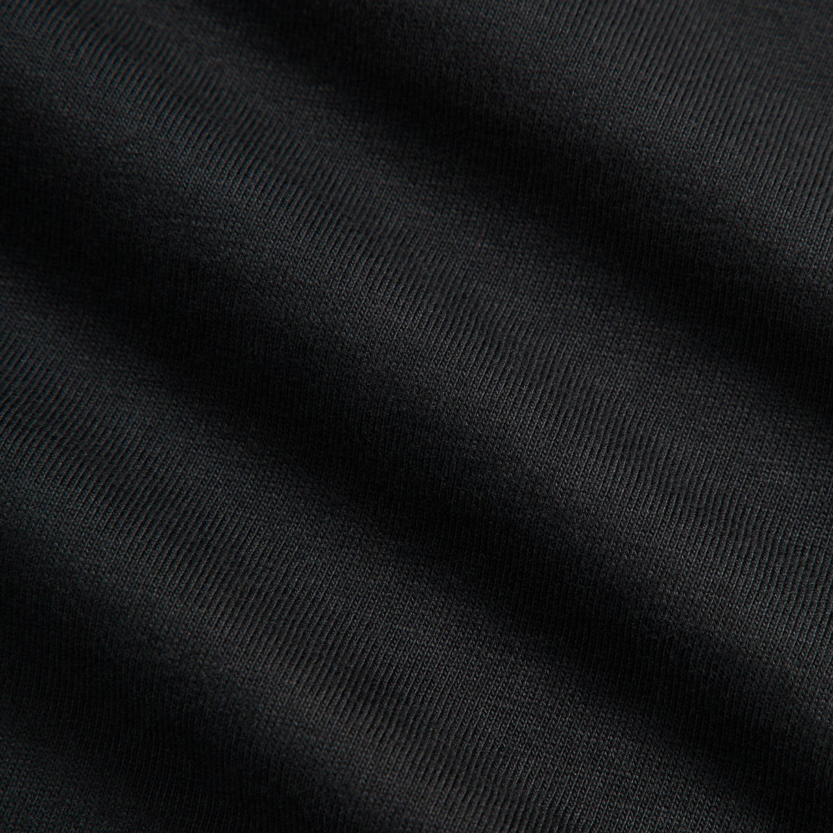 Close-up of black cotton jersey fabric texture, Kith Ivy Classic Logo Tee