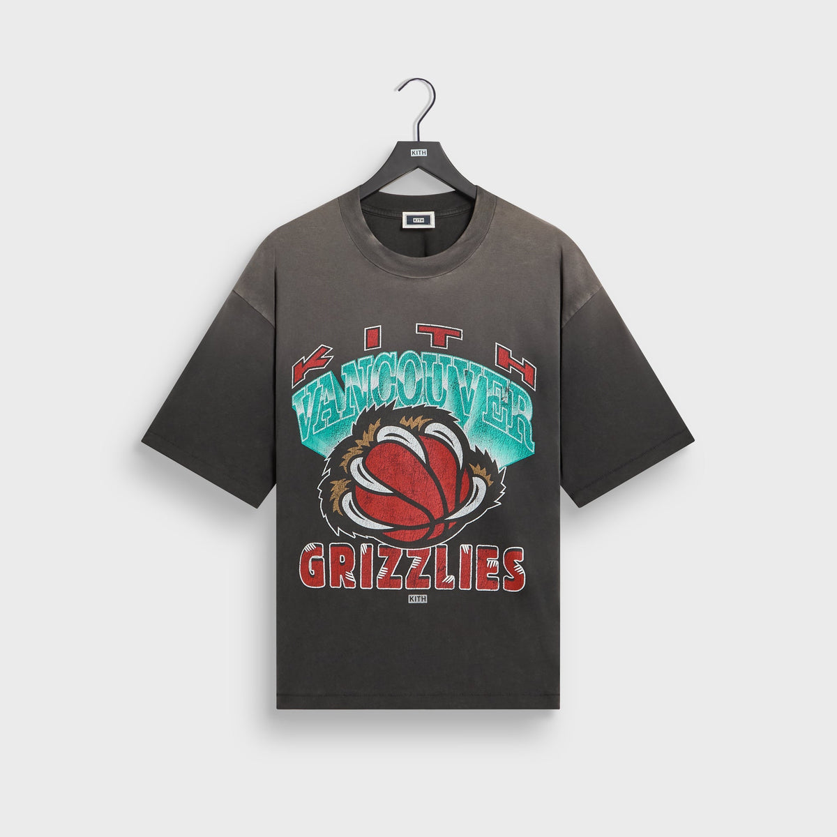 Kith for the Vancouver Grizzlies Vintage Jones II tee in faded black on hanger, front view with distressed Grizzlies bear claw basketball graphic