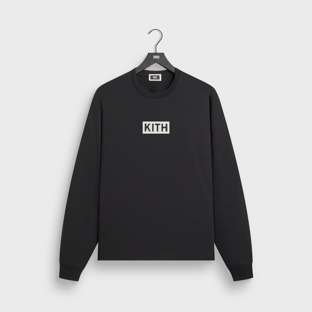 Kith Vancouver Geometric long sleeve tee in black on hanger, front view with white Kith box logo on chest