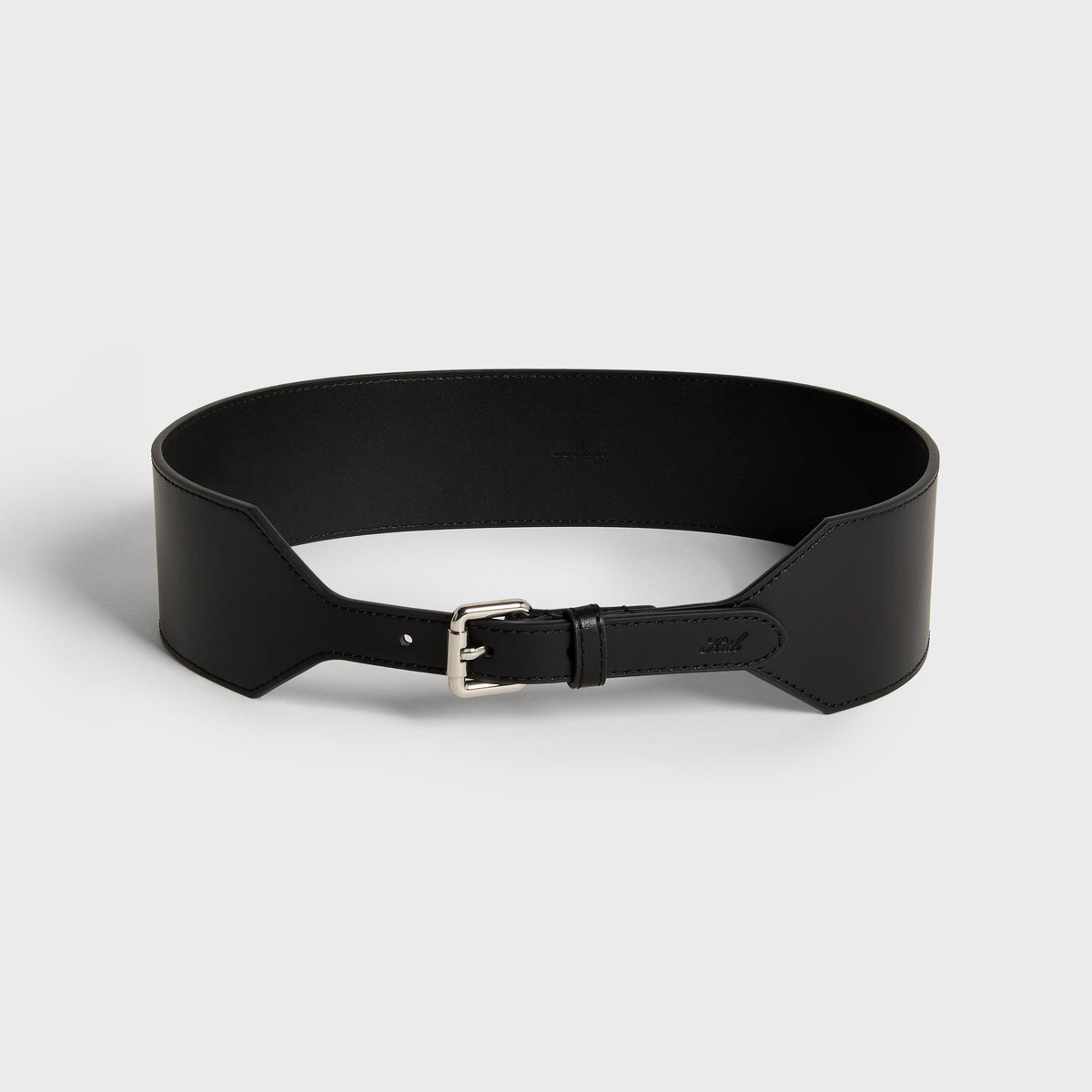 Kith Women tapered belt in black leather with wide hexagonal panels and silver roller buckle, coiled view