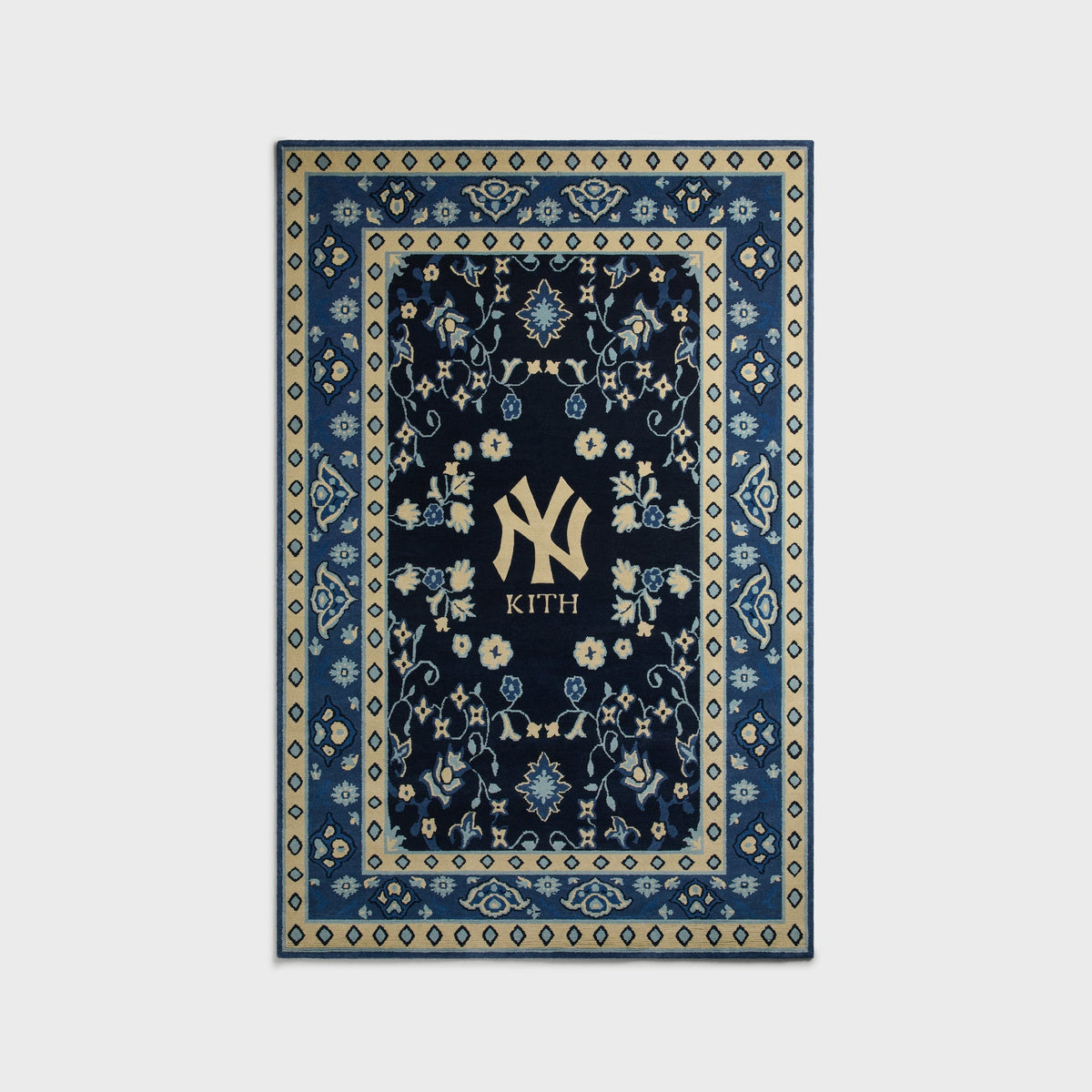Kith & Kasra Rugs NY Yankees 5x8 hand-knotted rug in Nocturnal navy, front view with cream diamond border