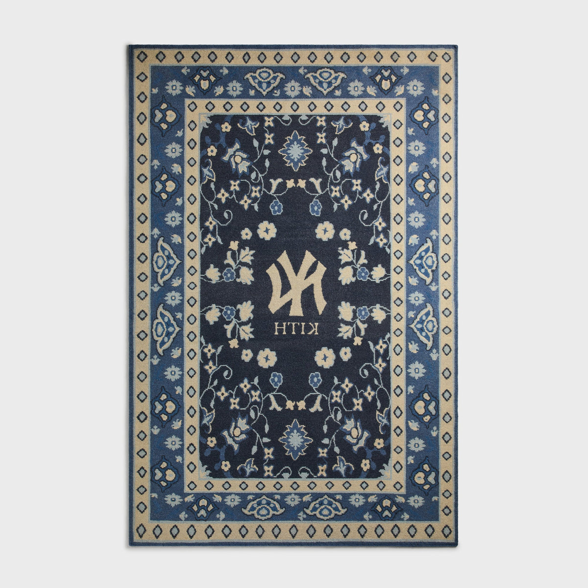 Kith & Kasra Rugs NY Yankees 8x10 rug in Nocturnal, reverse-side view showing mirrored Yankees logo and KITH text