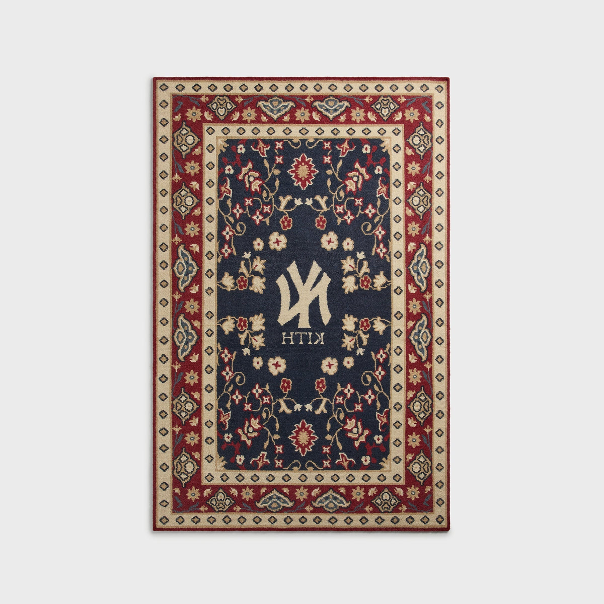 Kith & Kasra Rugs NY Yankees 5x8 rug in Multi, reverse-side view showing mirrored Yankees logo and KITH text