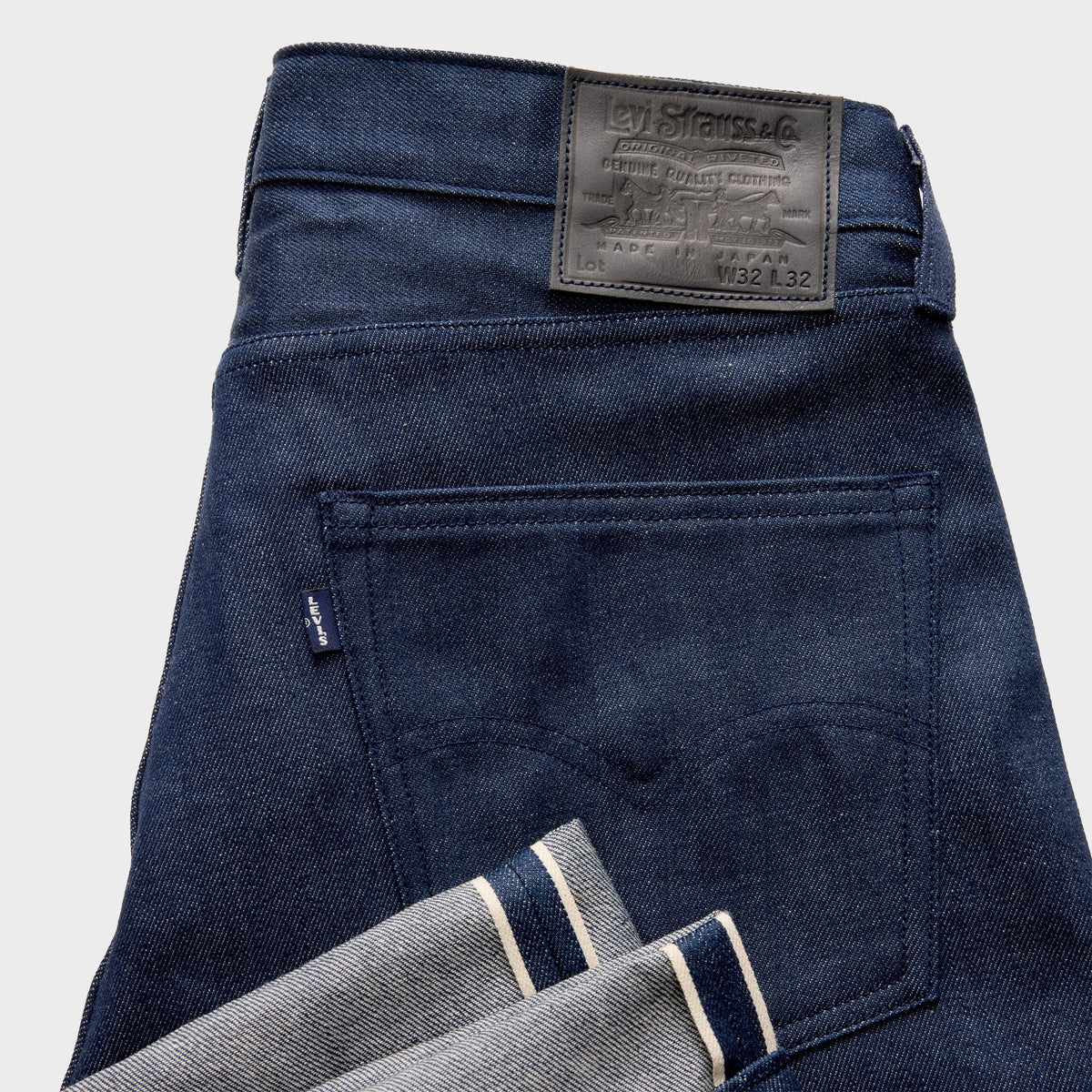 Levi's Blue Tab Anchor Jean in Deep Blue Well dark wash, close-up of back pocket, selvedge cuff and leather patch