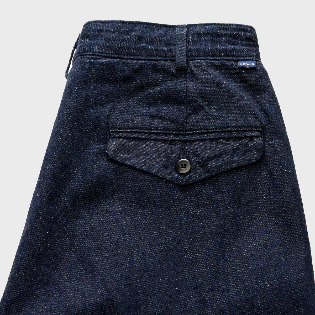 Levi's Blue Tab Wide Leg Flyer Jean in magic rinse dark wash, close-up of back flap pocket with button and Levi's tab