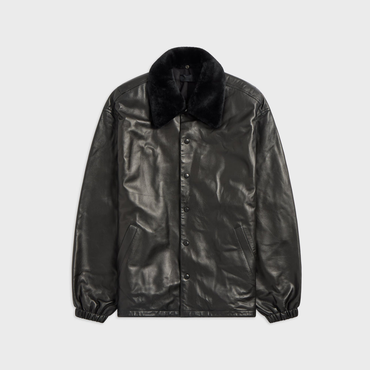 Willy Chavarria Leather Coach Jacket in black, front view, snap-front leather jacket with black shearling collar