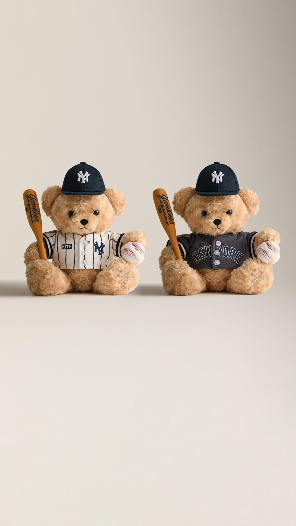 Two Kith for New York Yankees teddy bears in pinstripe and grey jerseys with NY caps, holding baseball bats and balls, mobile banner