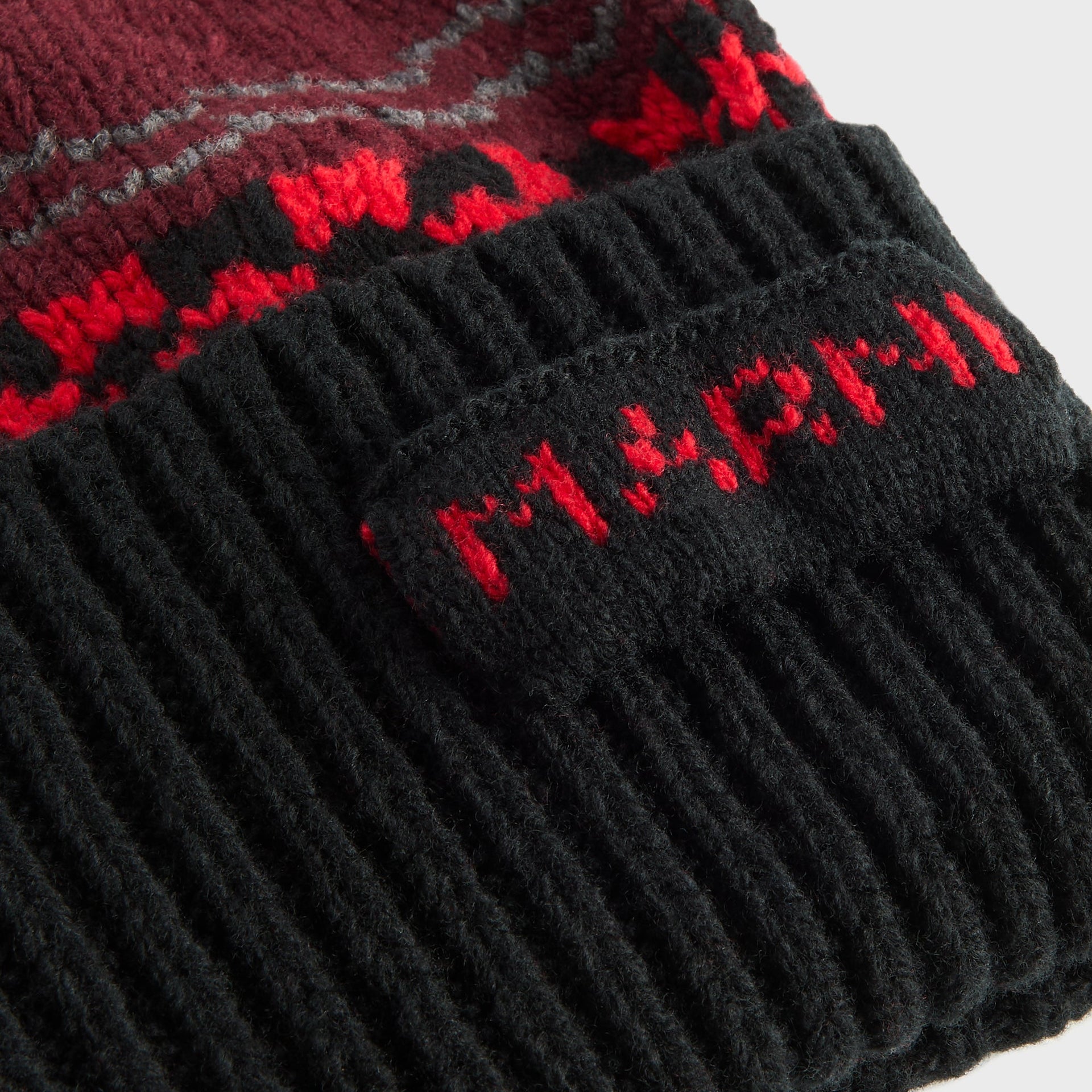 Marni knit wool beanie detail, close-up of black ribbed cuff with red knit-in Marni logo