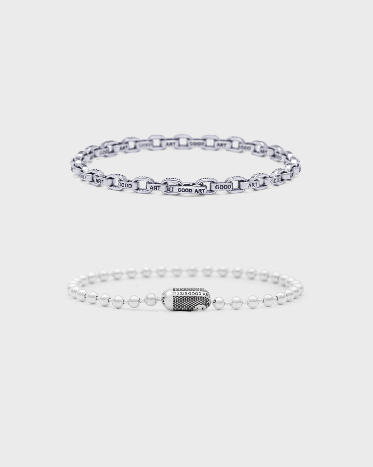 Good Art HLYWD sterling silver curb-link chain bracelet and beaded ball-chain bracelet, flat lay