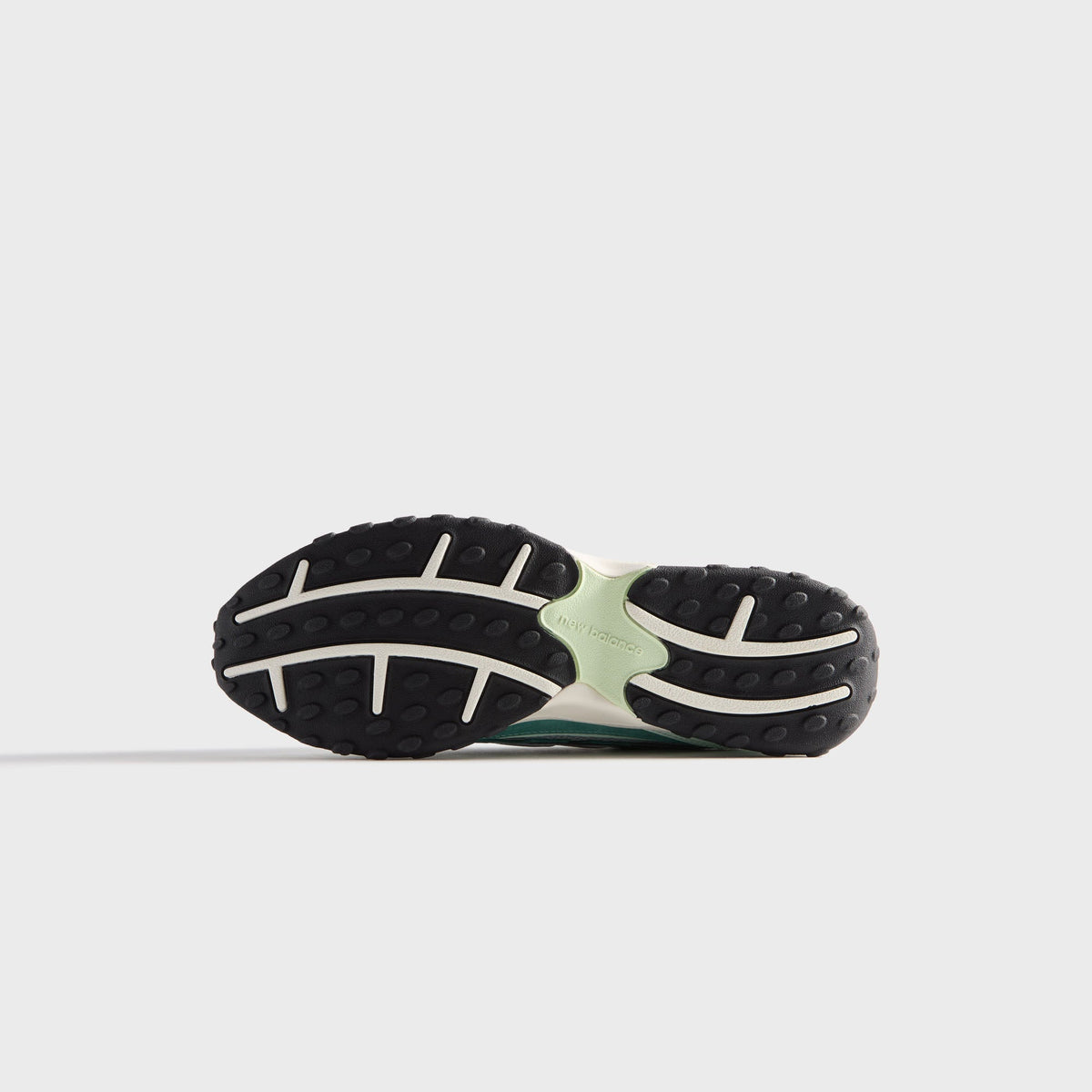 Kith & New Balance 204L in Bluebell, bottom view of the black and mint rubber outsole tread