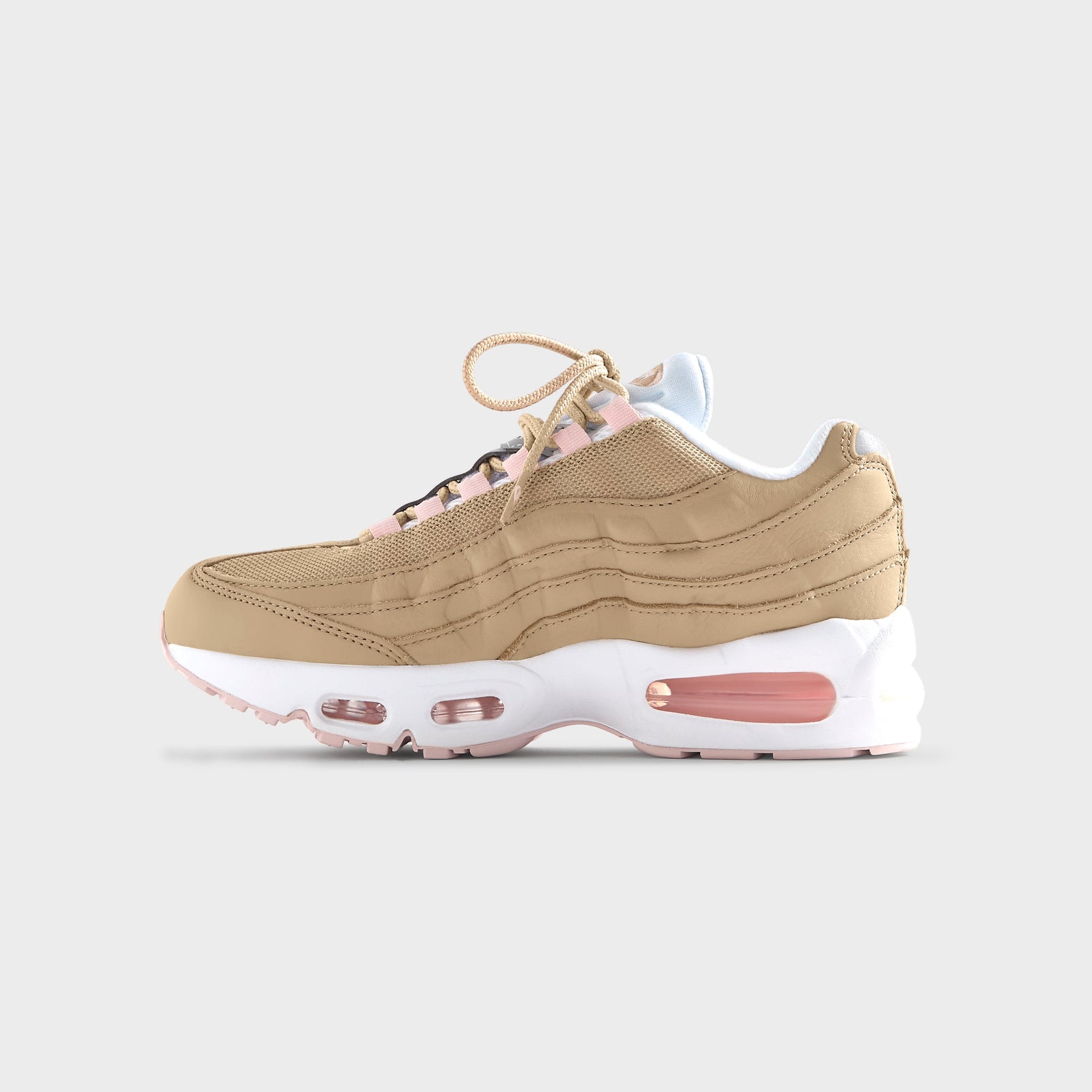 Translucent pink outsole of the Kith Kids x Nike GS Air Max 95 Linen, seen from below (additional studio view)