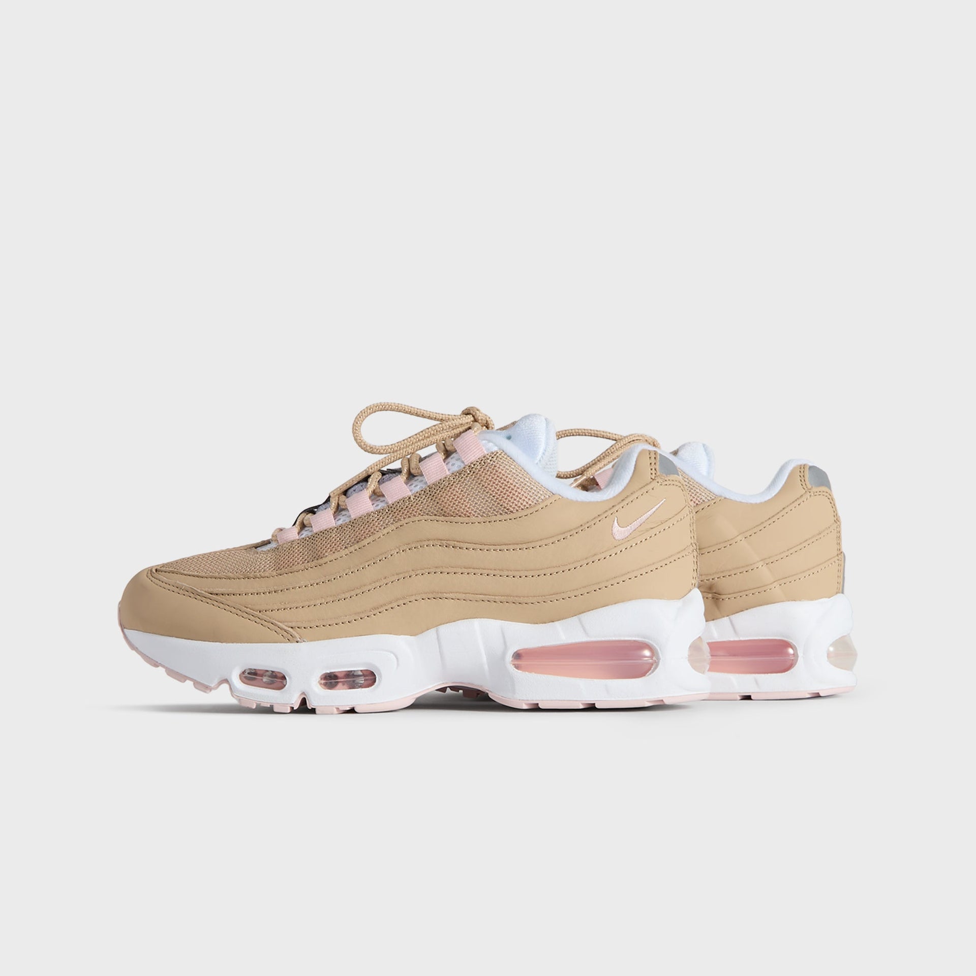 Kith Kids x Nike GS Air Max 95 Linen pair, small front three-quarter angle in wheat linen with pink (additional studio view)