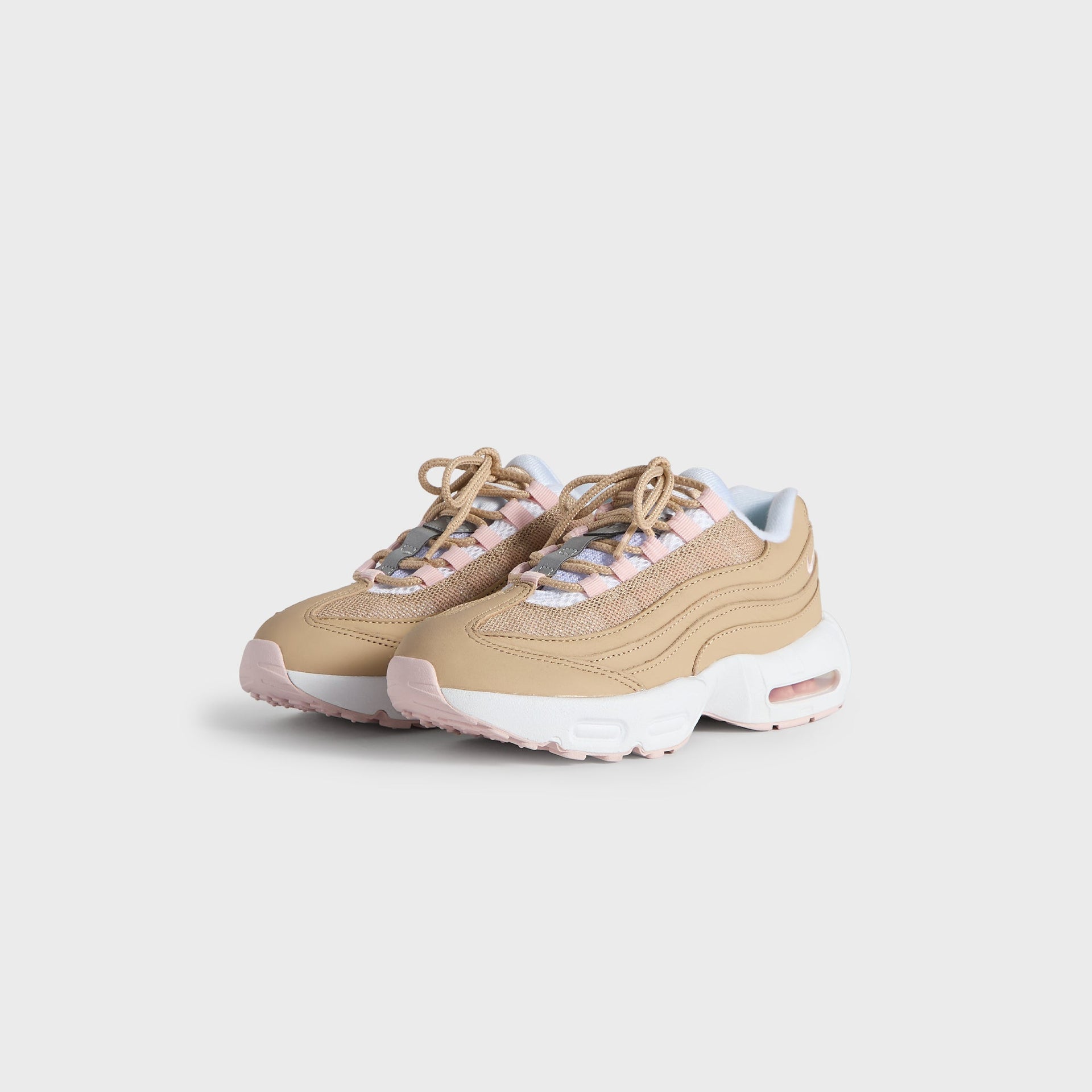 Kith Kids x Nike PS Air Max 95 Linen pair angled from the front, linen upper with pink accents and tan laces