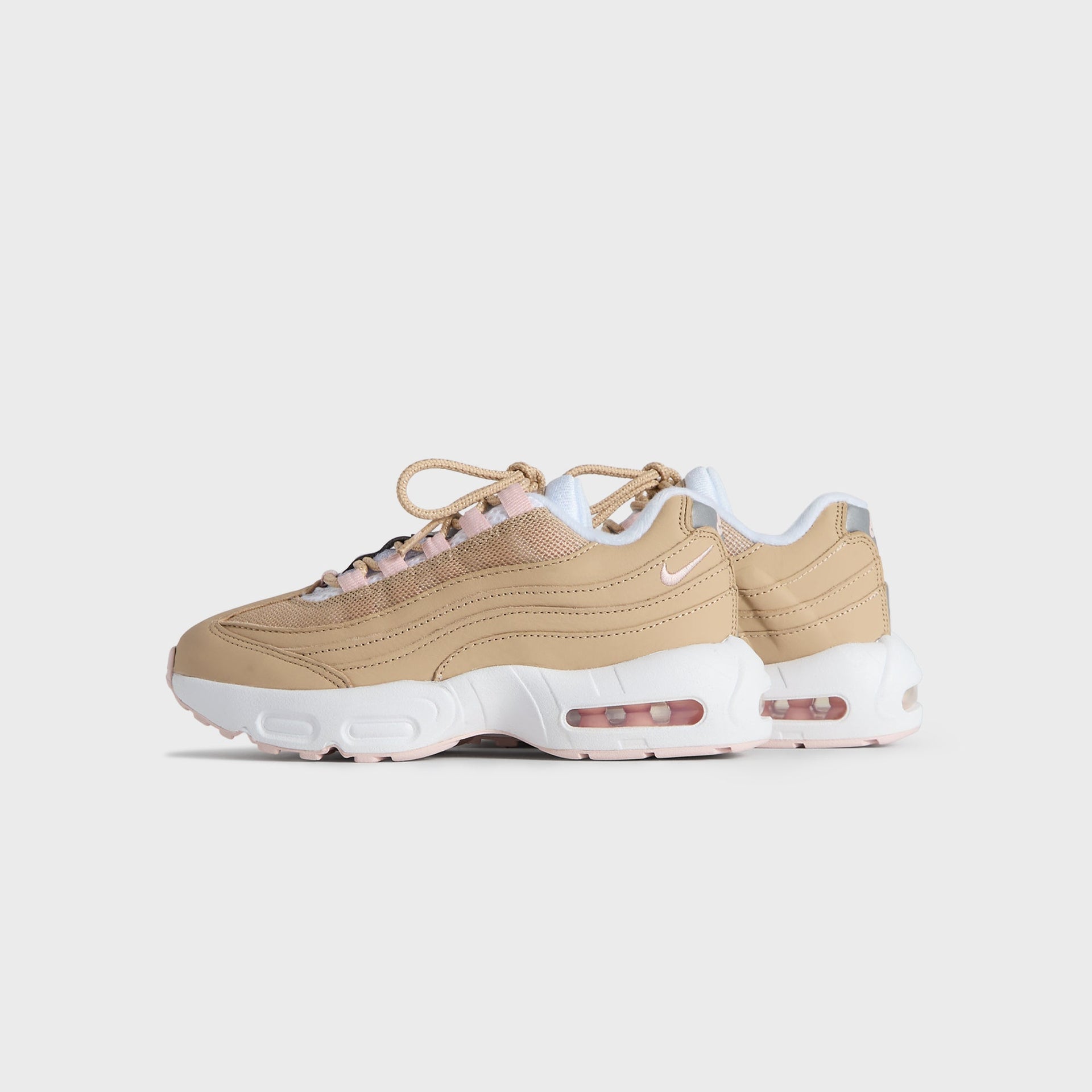 Kith Kids x Nike PS Air Max 95 Linen pair, small front three-quarter angle in wheat linen with pink (additional studio view)