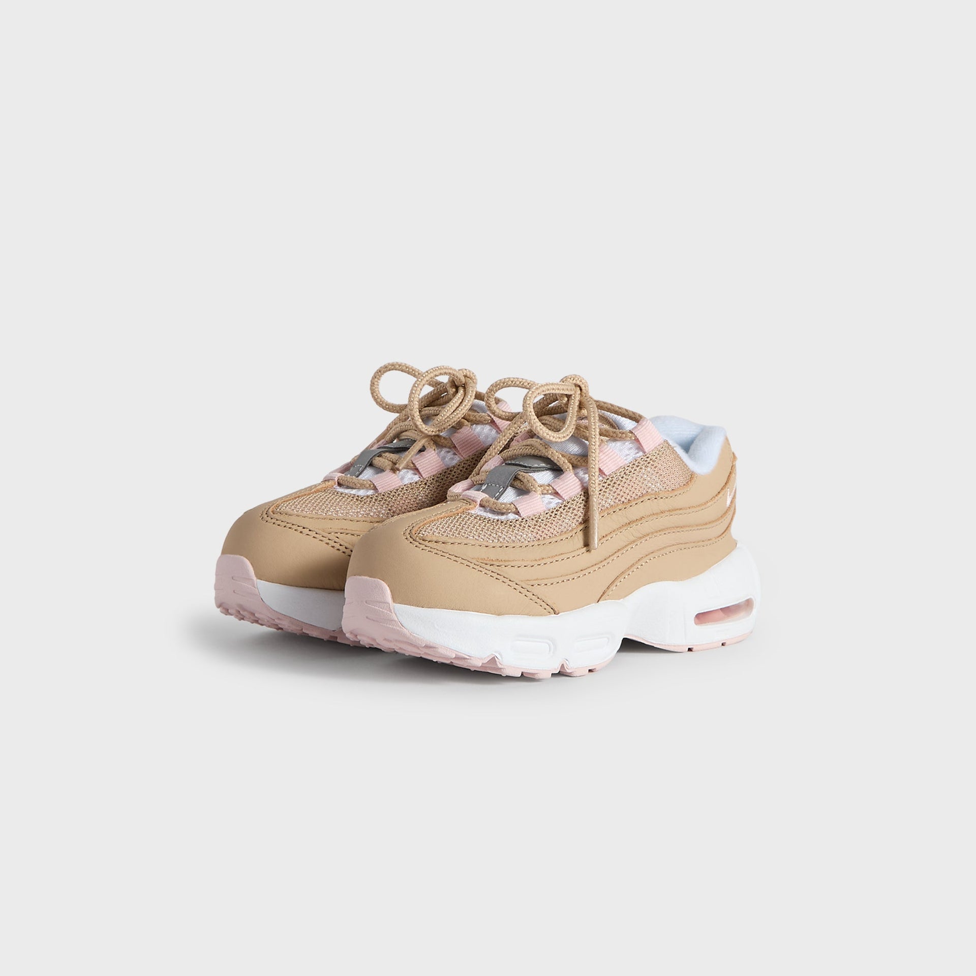 Kith Kids x Nike TD Air Max 95 Linen pair angled from the front, linen upper with pink accents and tan laces