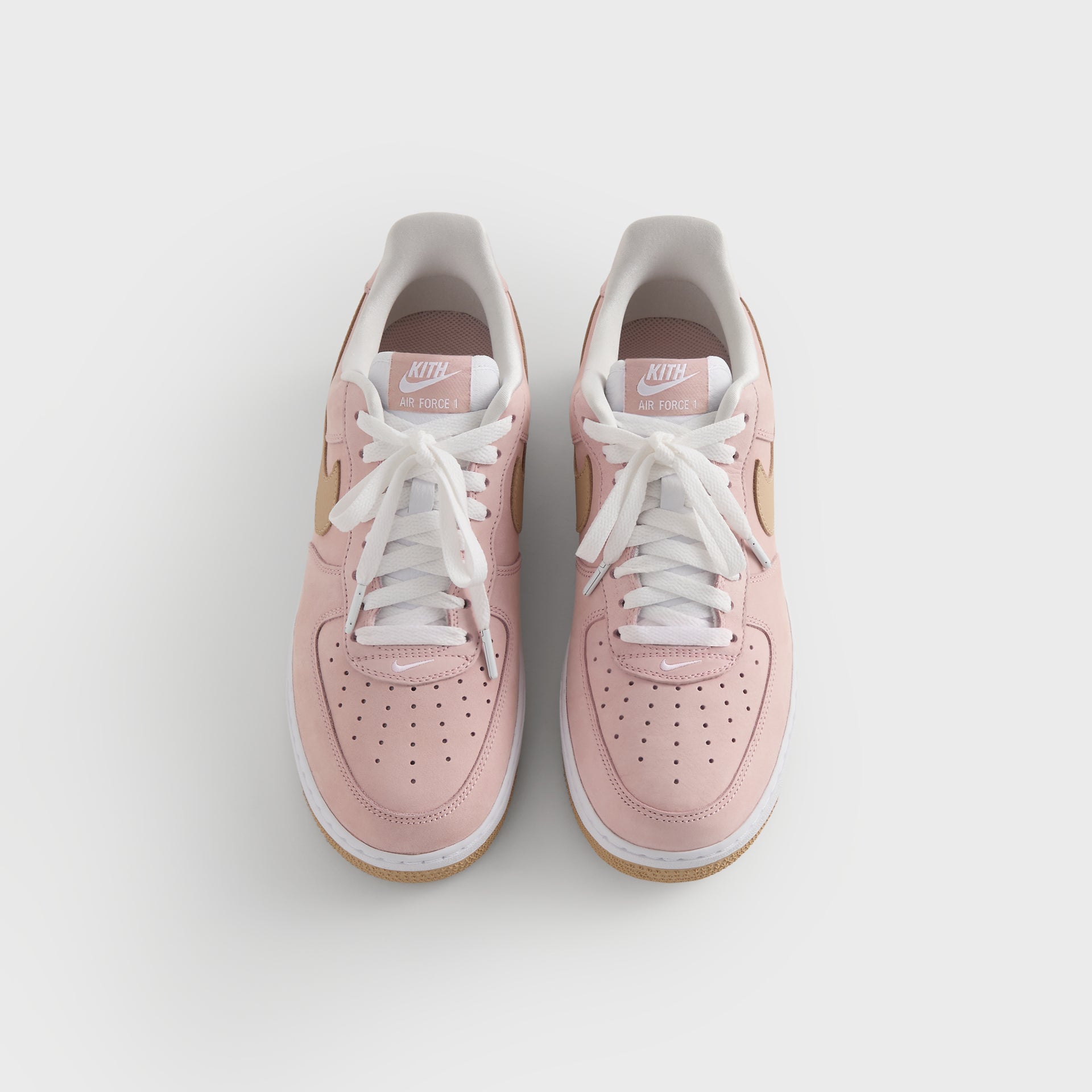 Kith x Nike Air Force 1 Un-Linen pair from above, pink suede uppers and white laces